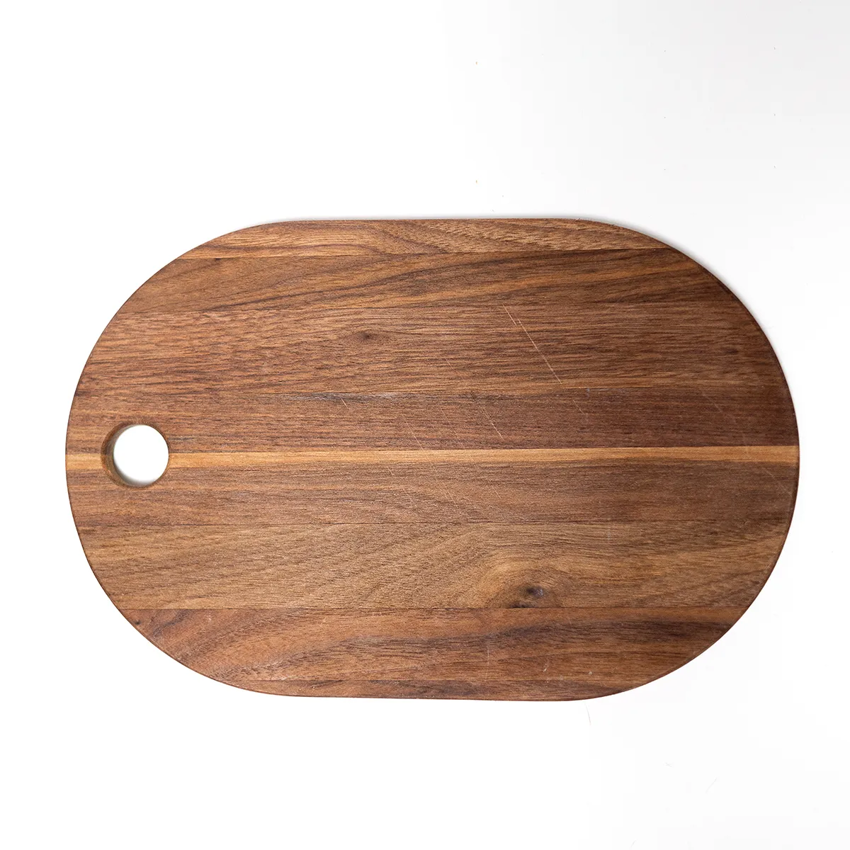 Medium Oval Shaped CuttingBoard with hole for easy handling, with minimal ware. Wood Grain, Walnut Colored