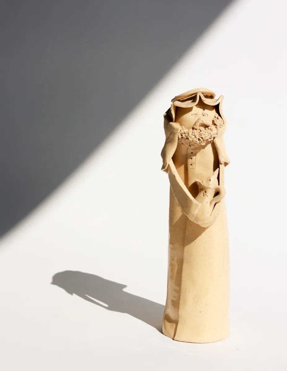 Cream Colored Ceramic Figurine From Saudi Arabia, bearded man wearing a keffiyeh holding a tea pot