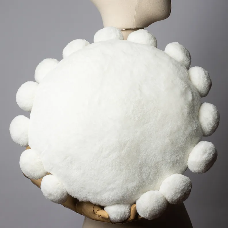 Round White Pillow with puffy balls along the edge - 