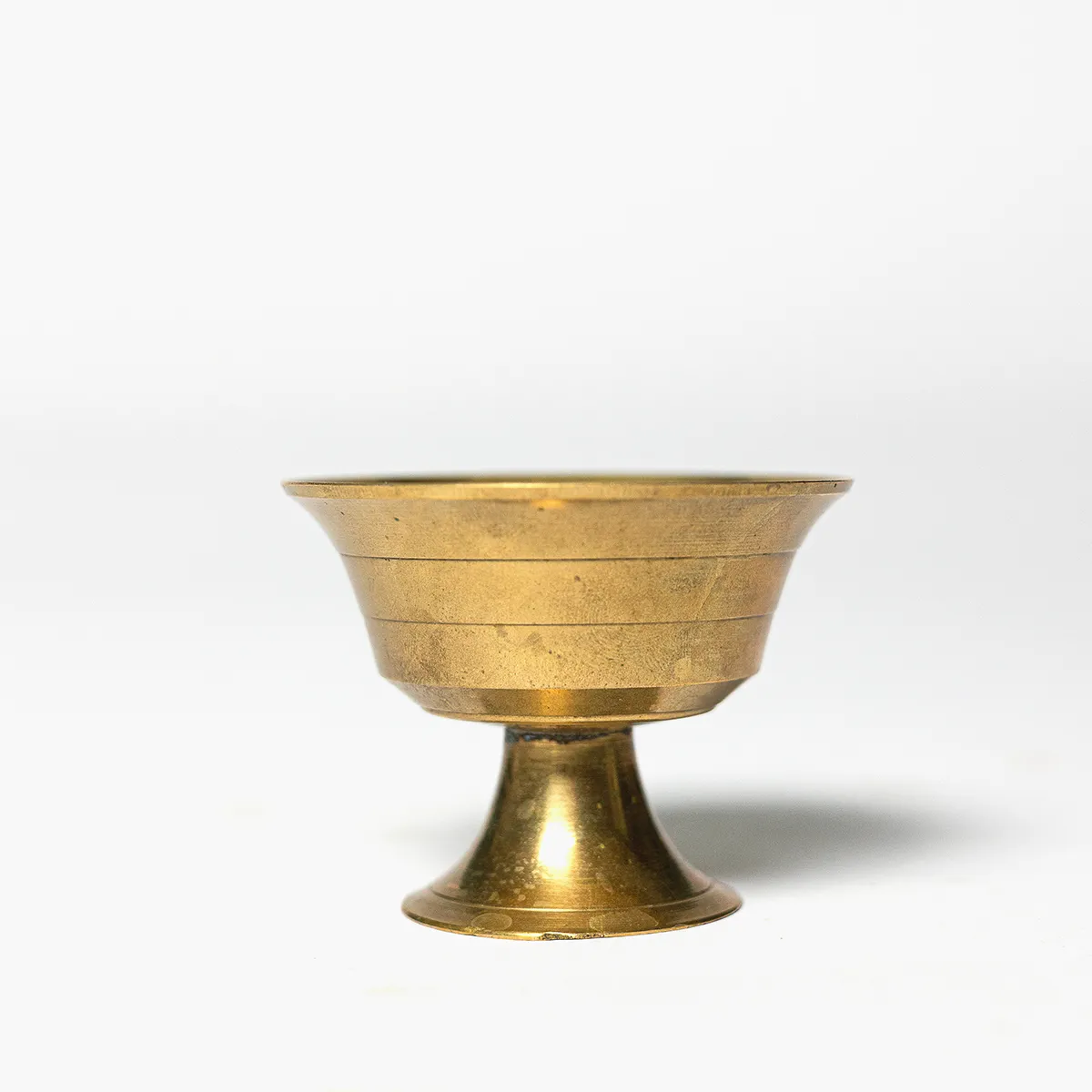 Small brass footed egg cup.