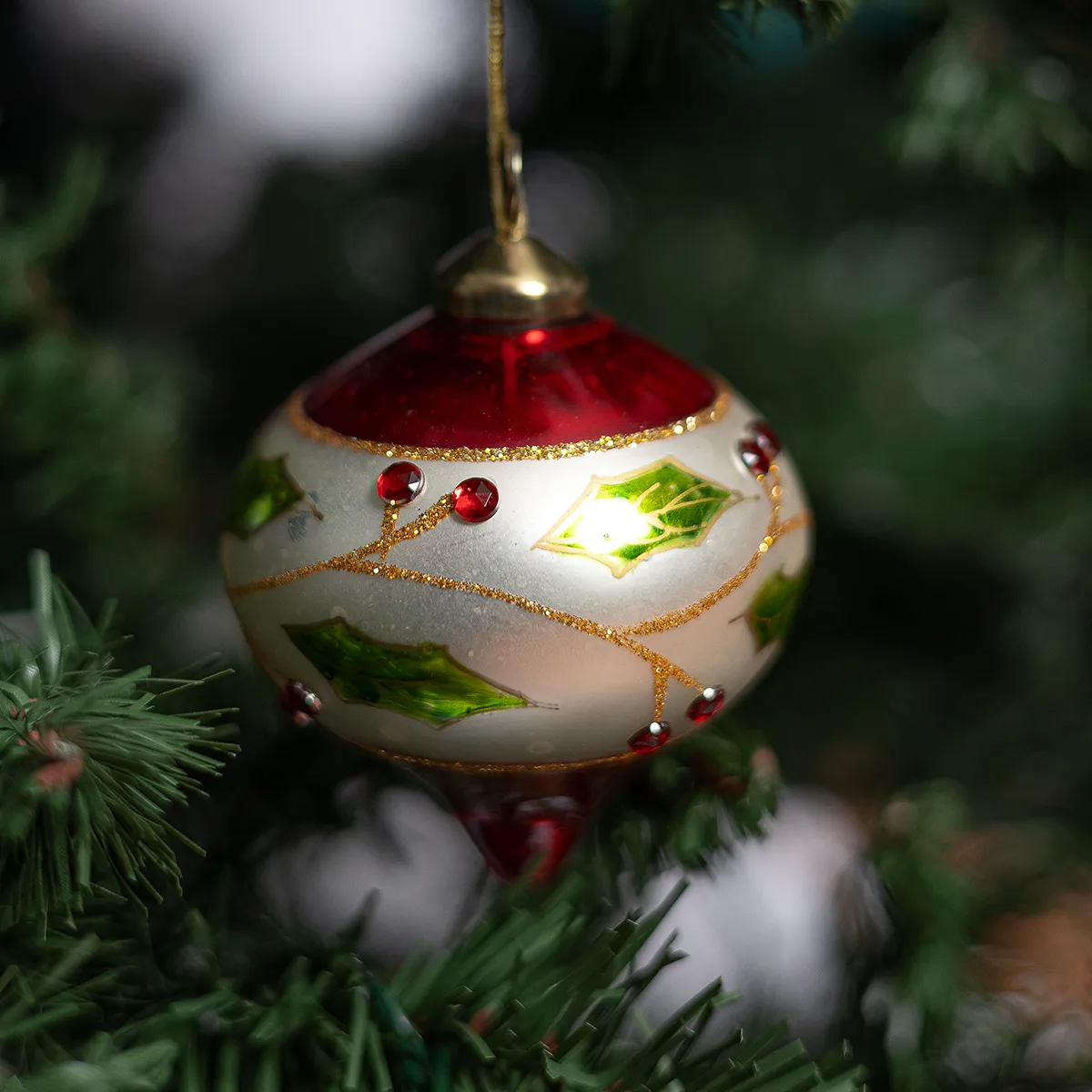 Red and Cream Glass Christmas bulb ornament with holly leaves