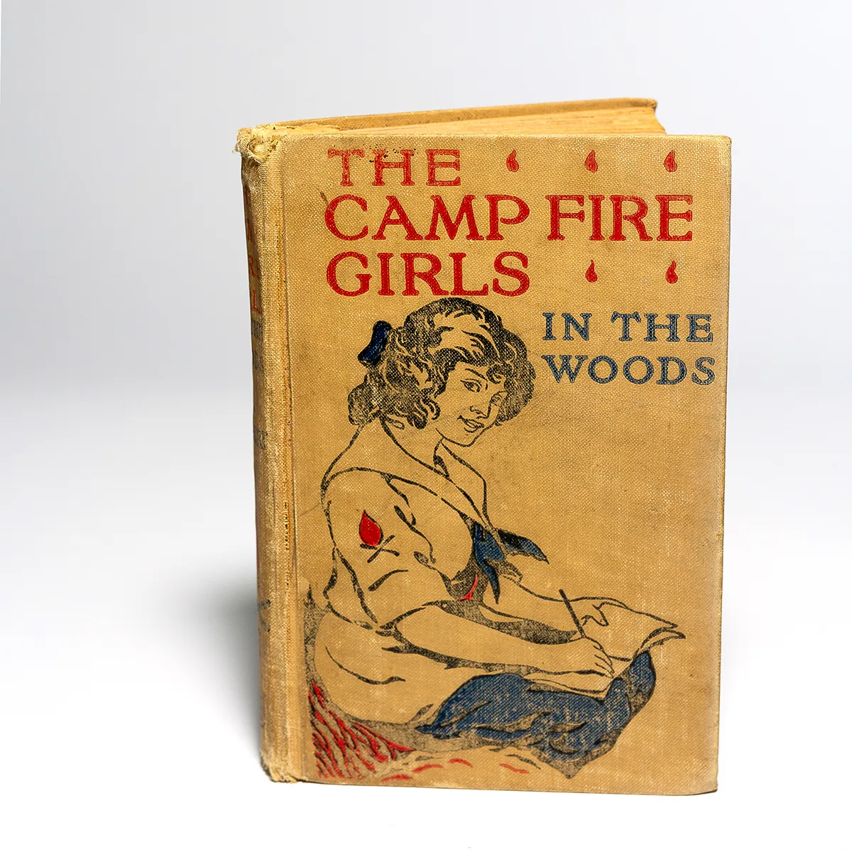 Vintage Fabric Covered Book The Camp Fire Girls in the woods warm, yellow, off white - 7.75" x 5.25" x 1" 