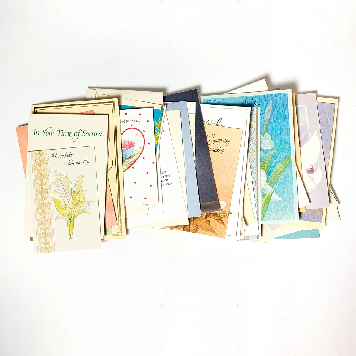 Thick Stack of Bereavment Cards and Letters in a Gold Bareavement Zipper Pouch 