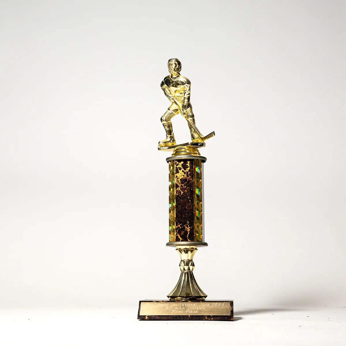 Dark Marbled Wood Base Gold figure of a hockey player Trophy