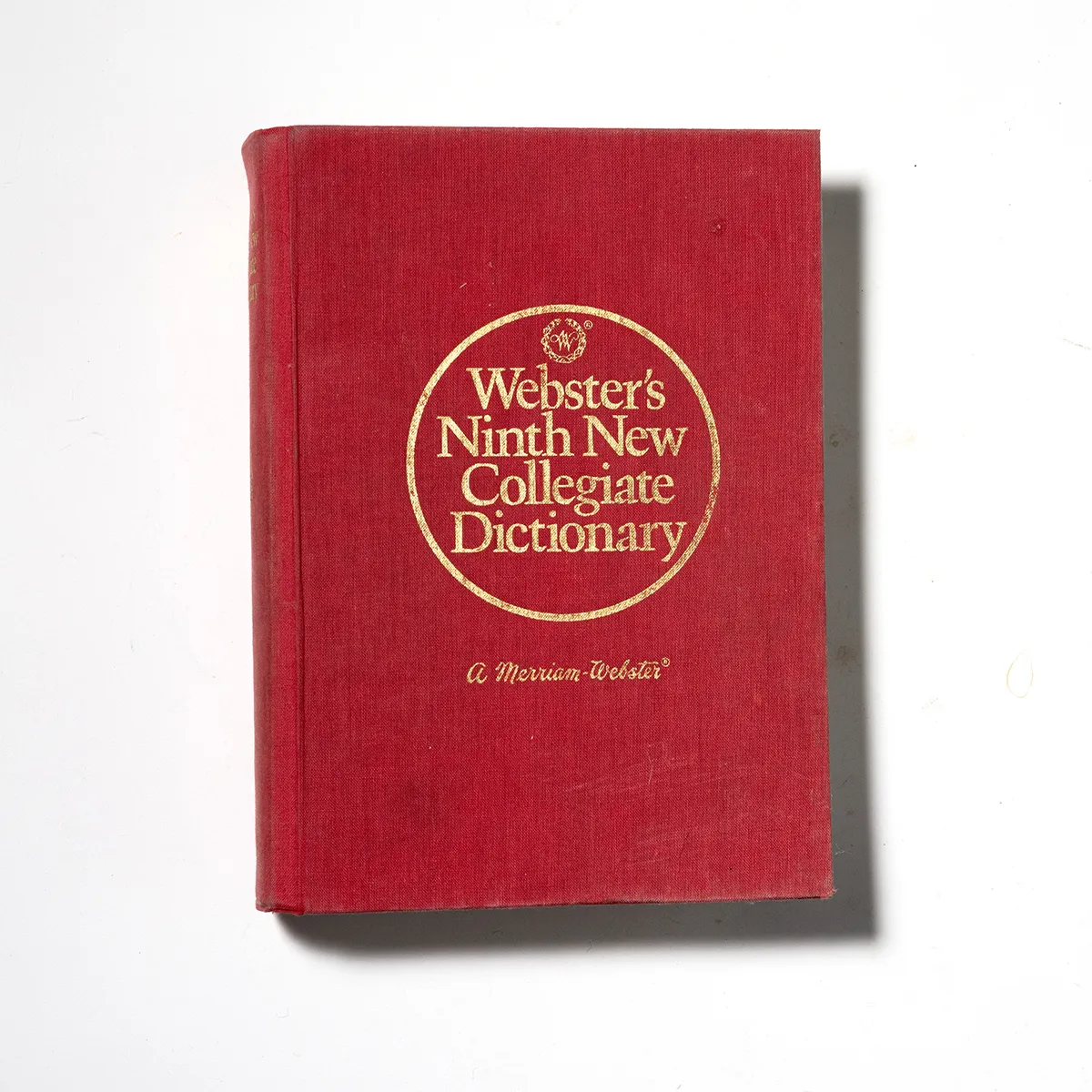 Book: Webster's 9th dictionary all red with Gold Lettering