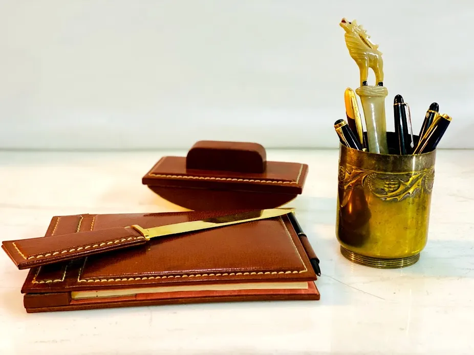 ABRECARTA CUERO SUELA Y BRONCE PESPUNTE