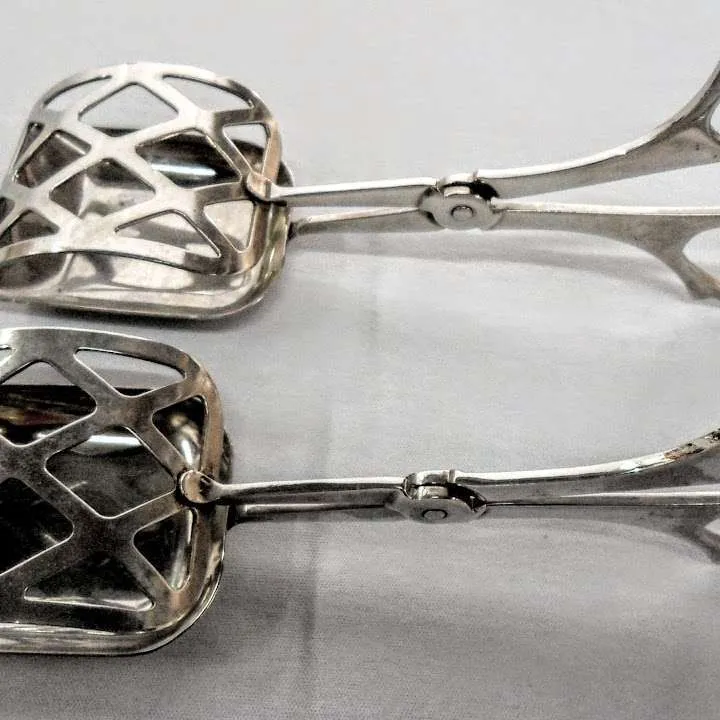 PINZAS  METAL PLATEADO ROMBOS