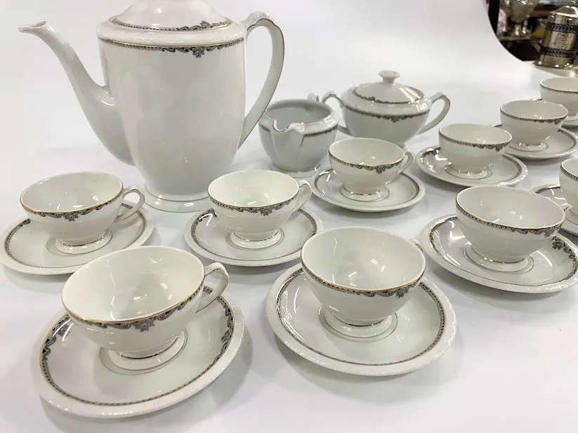 TAZA DE CAFE BAVARIA GUARDA ORO Y NEGRO - 