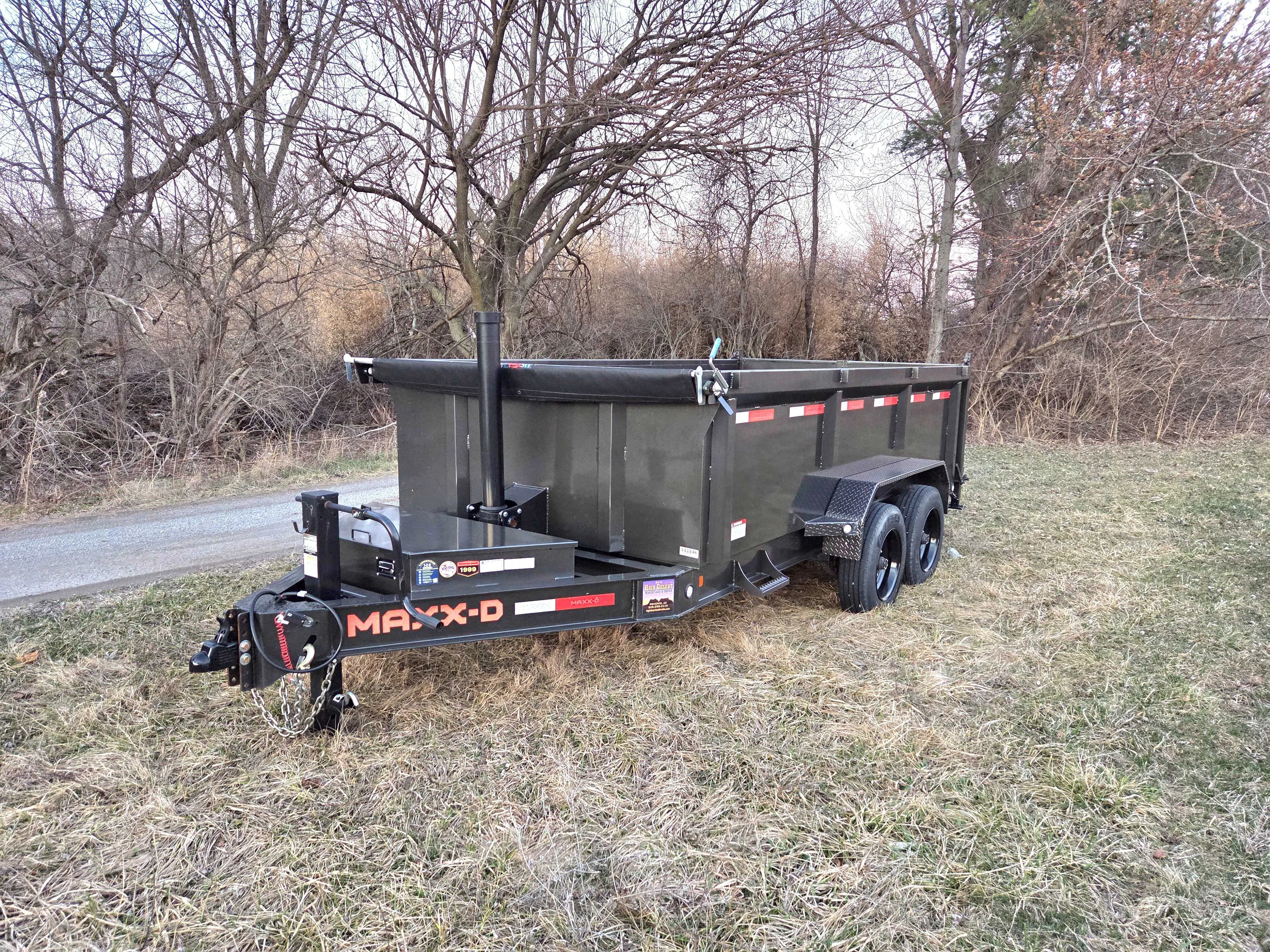 MAXXD 7x14 telescopic dump trailer with 3-foot sides, perfect for hauling and dumping heavy materials