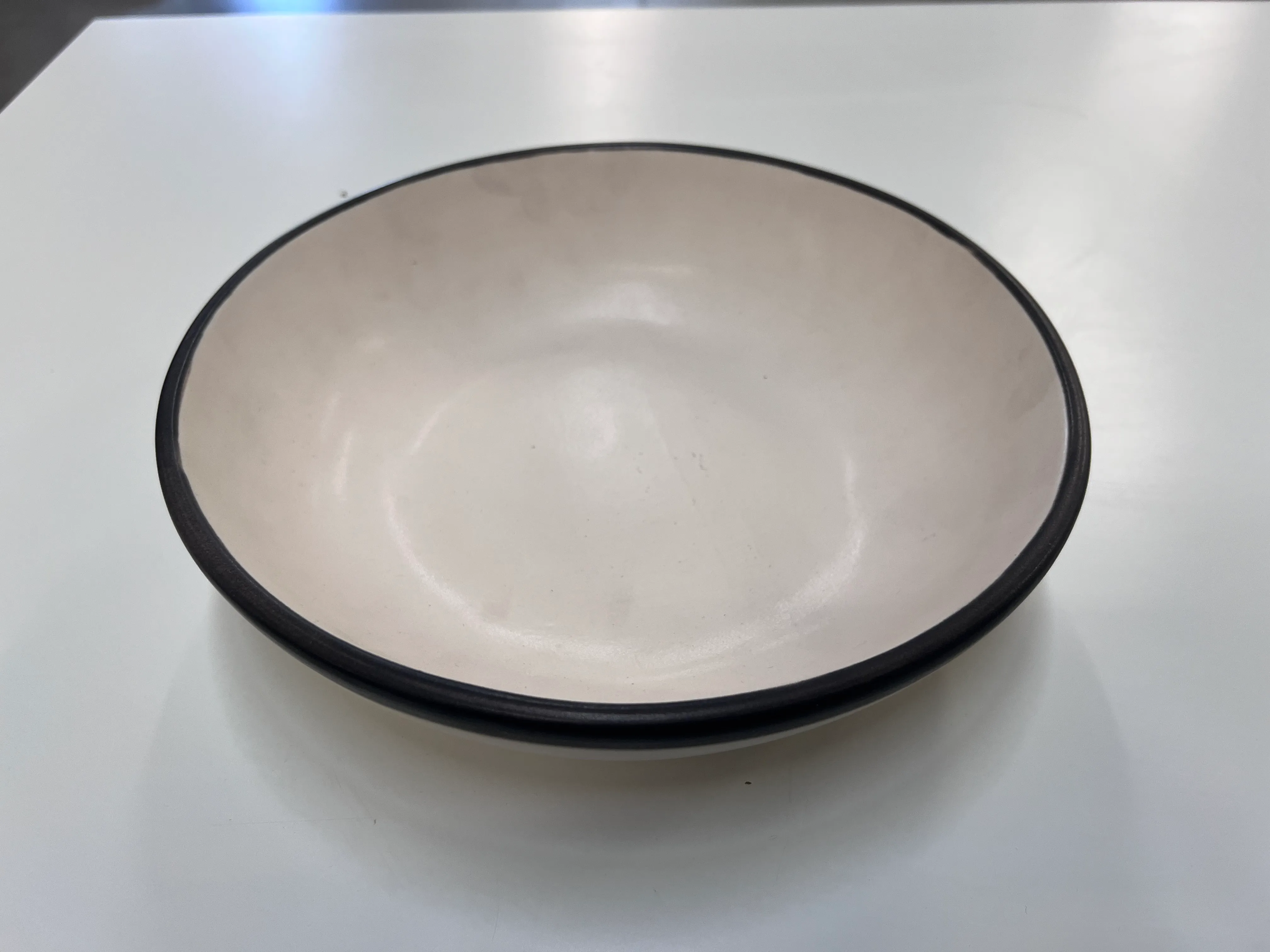 Cream serving bowl with brown rim