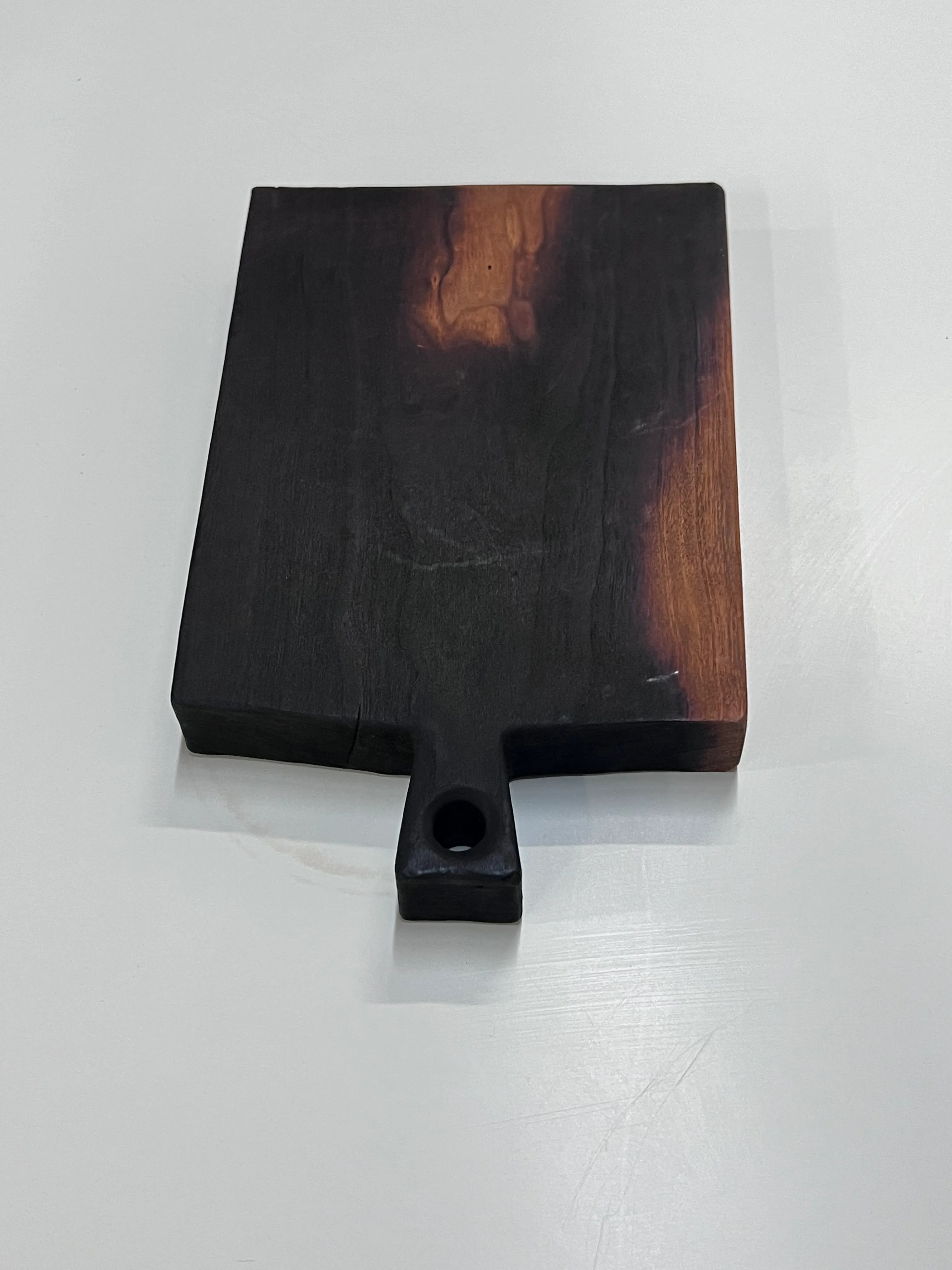 Small blackened wood cutting board 