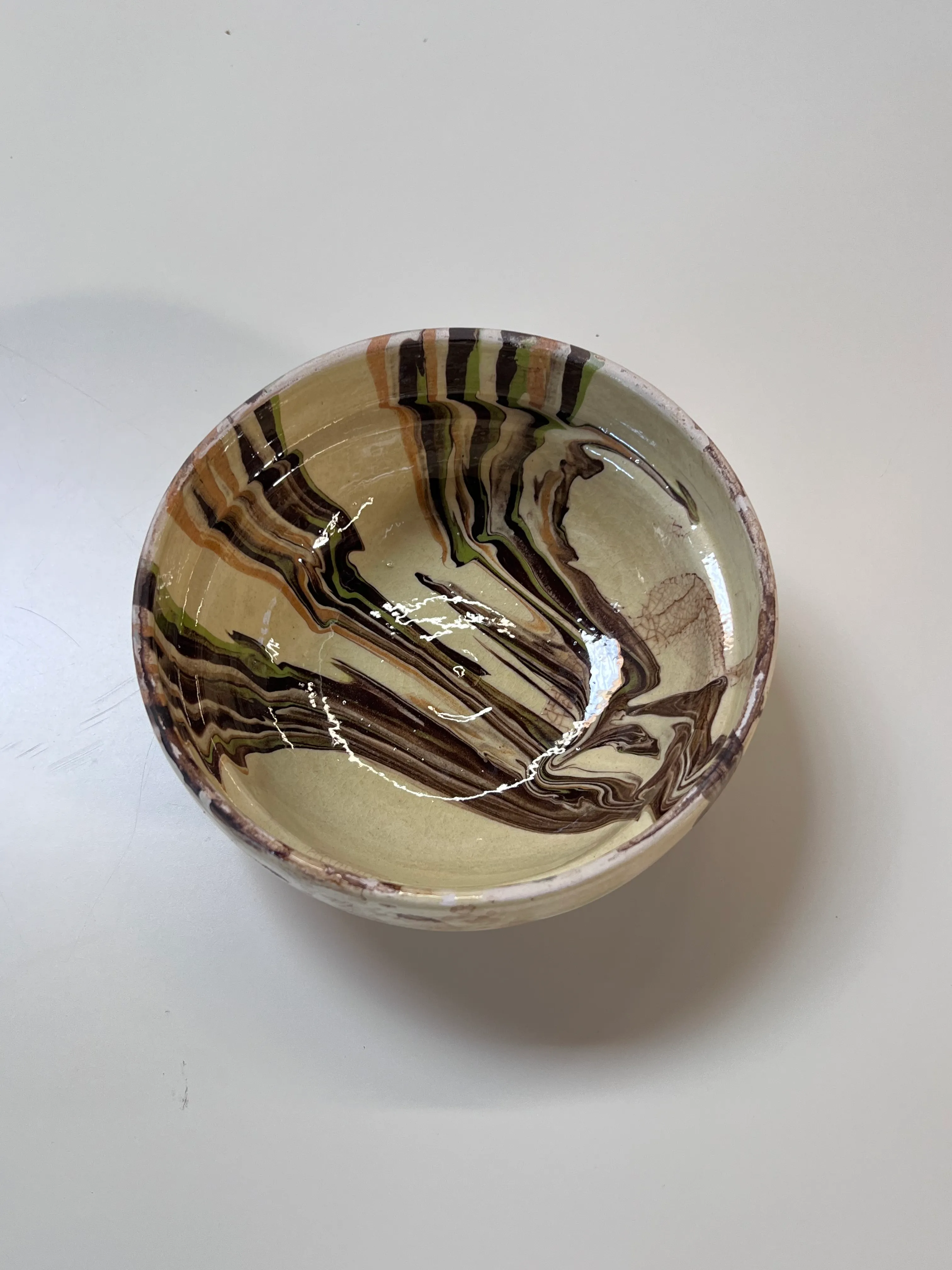 Yellow, brown, green paint swirl bowl - Juxtaposition