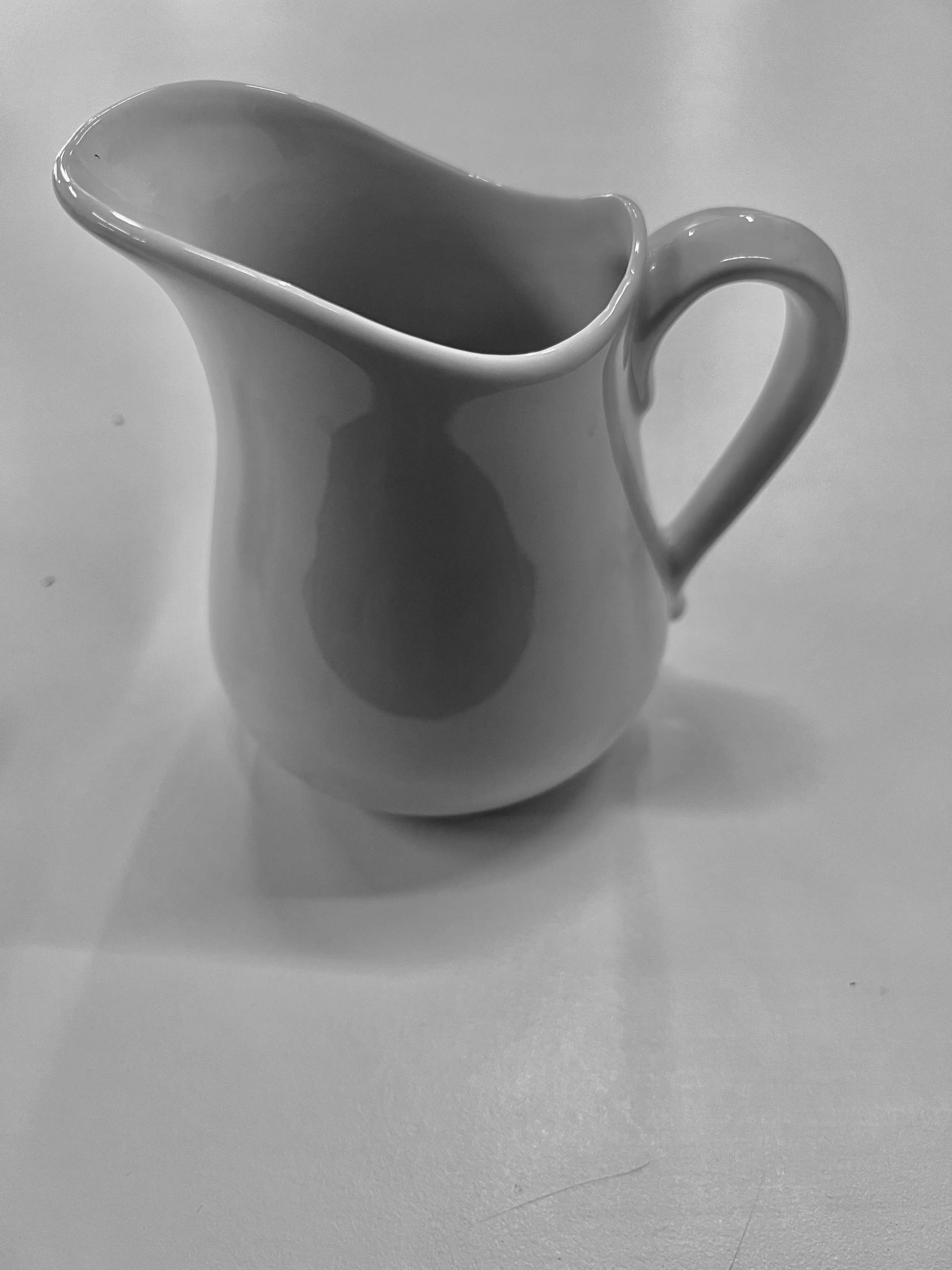 Simple small white pitcher