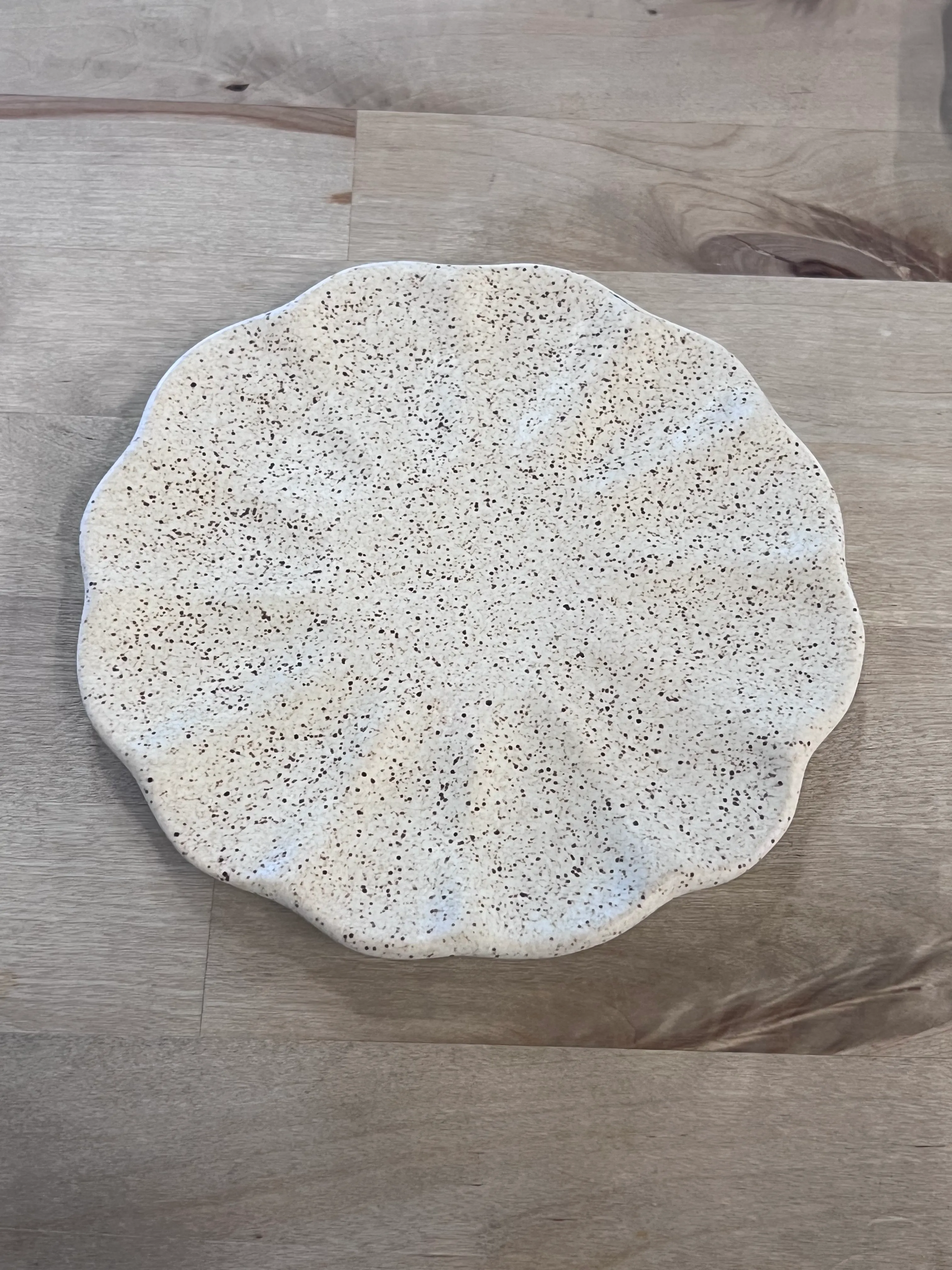 Beige speckled scalloped app plate