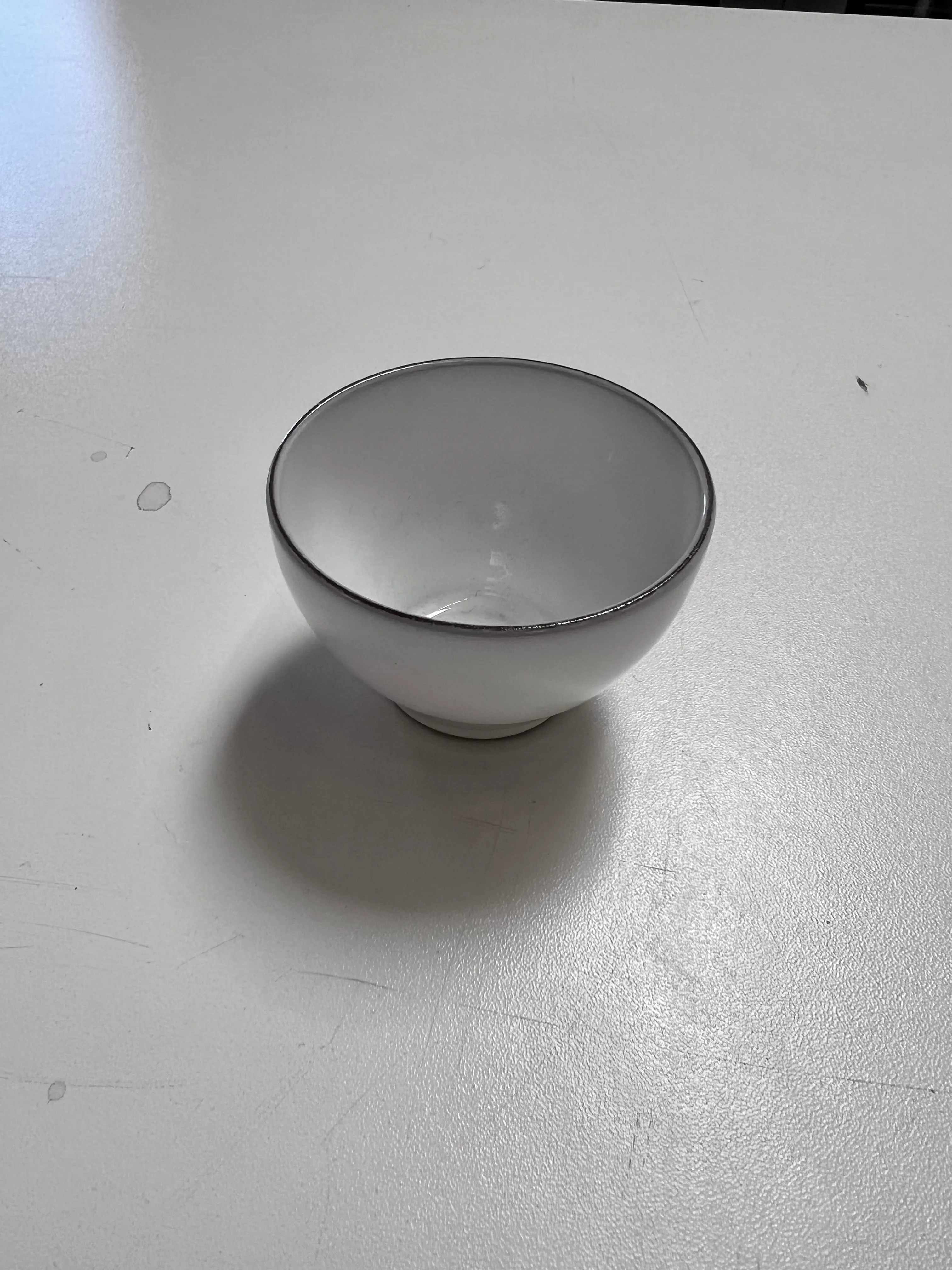 White mini bowl with brown rim