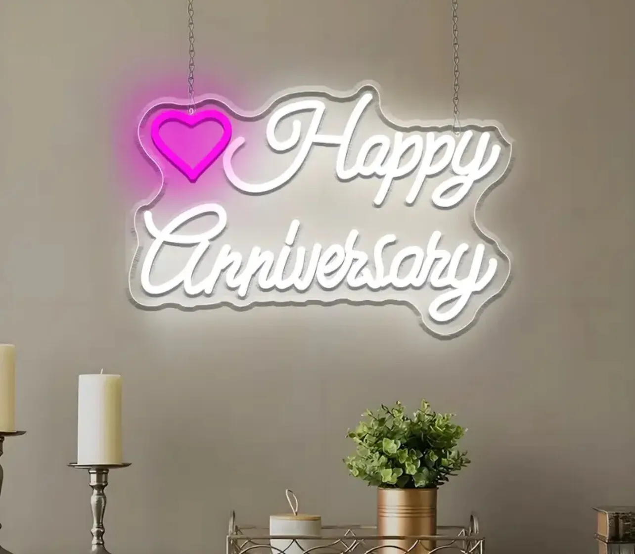 NEO light sign has a "Happy Anniversary" message with a pink heart design