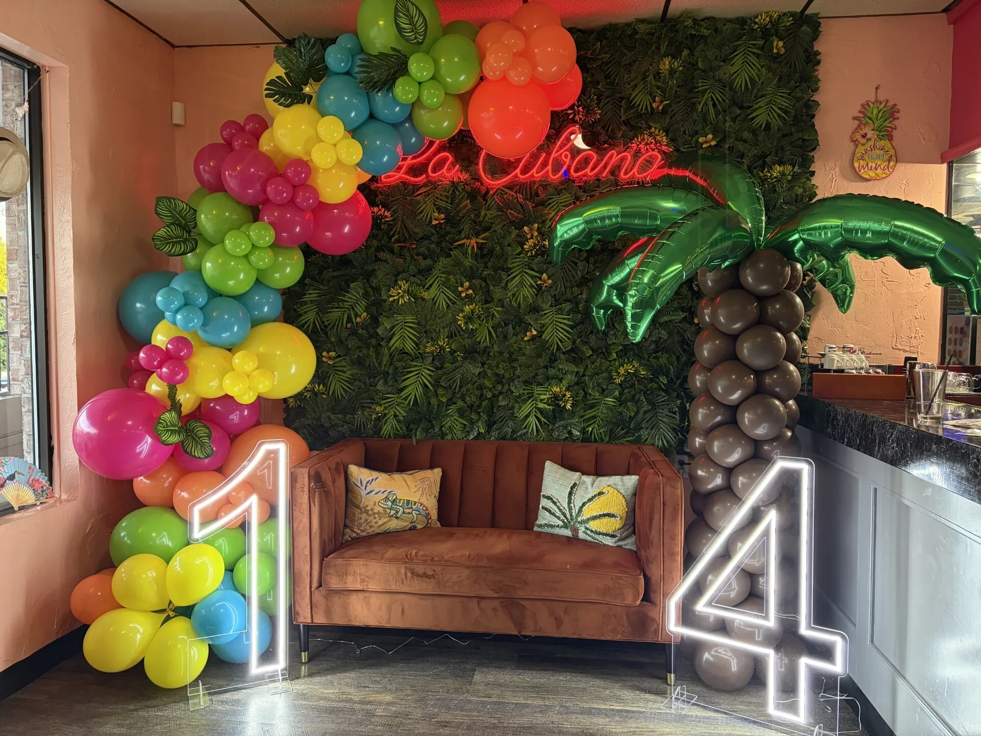 Tropical balloon décor with LED numbers and event rentals for La Cubana Restaurant anniversary celebration