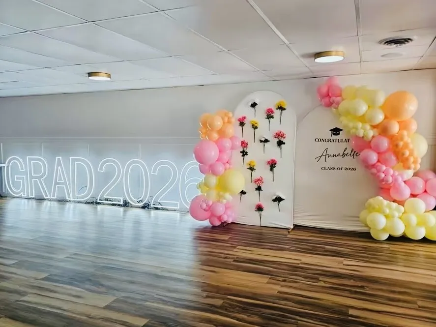 Graduation party setup with round tables chairs and balloon décor by RDL Balloons & Rentals in Blue Springs, MO