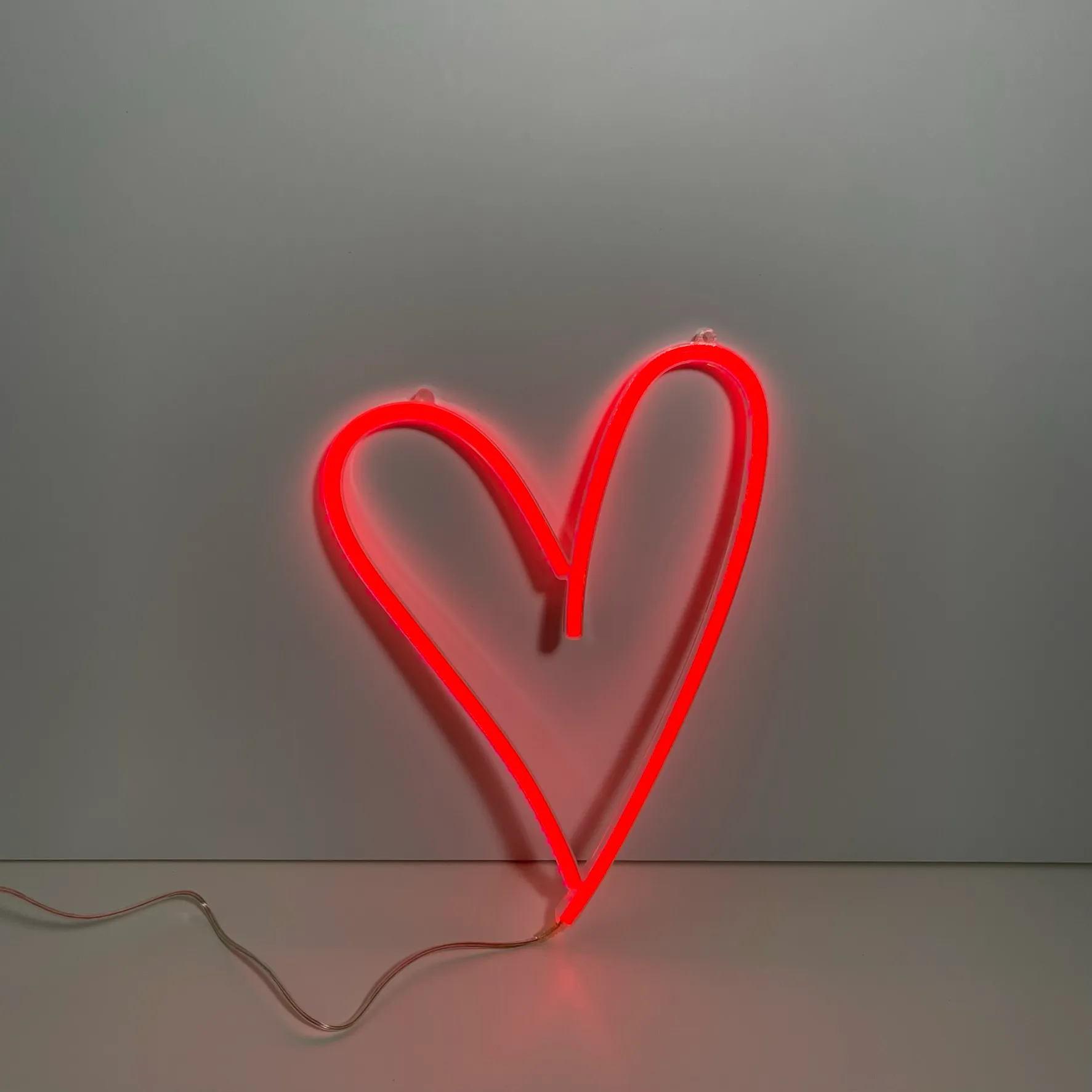 Neon heart shaped red