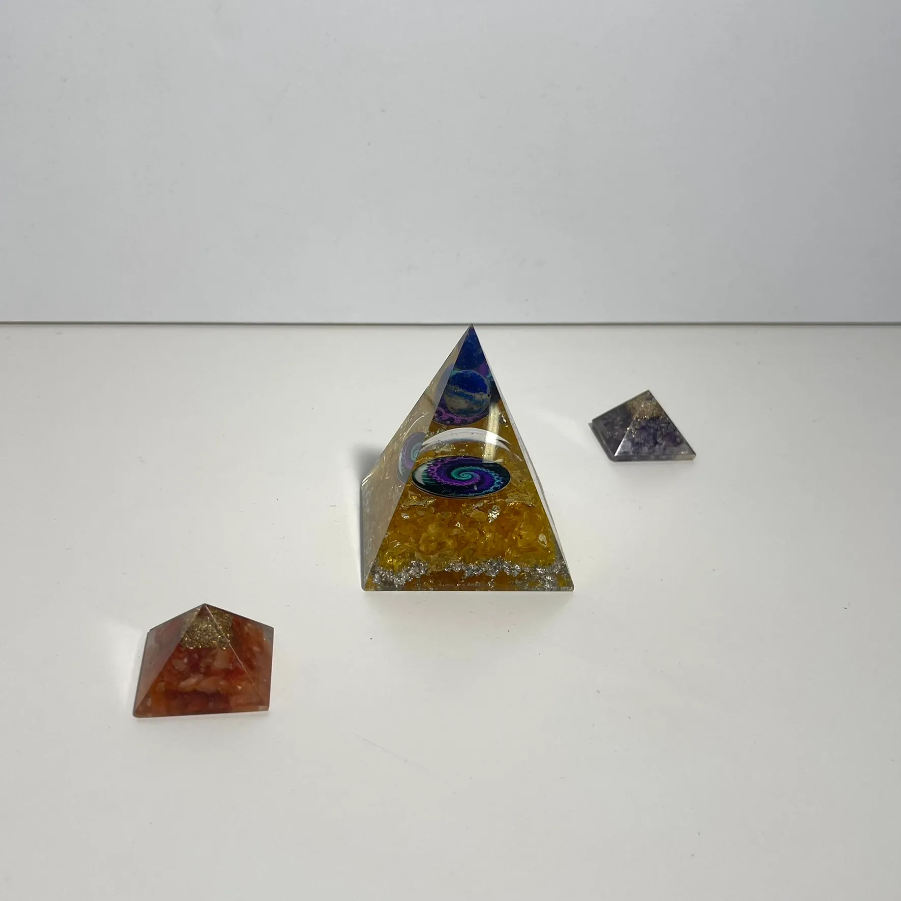 Three Glass Pyramid Figures
