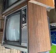 Woodgrain CRT TV on stand