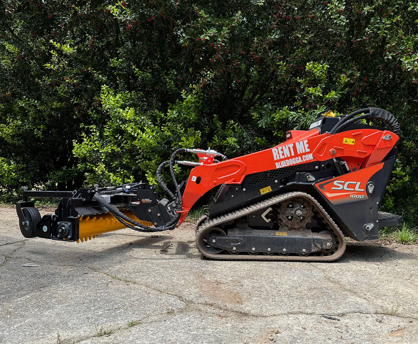 Kubota SCL1000 with Harley Rake