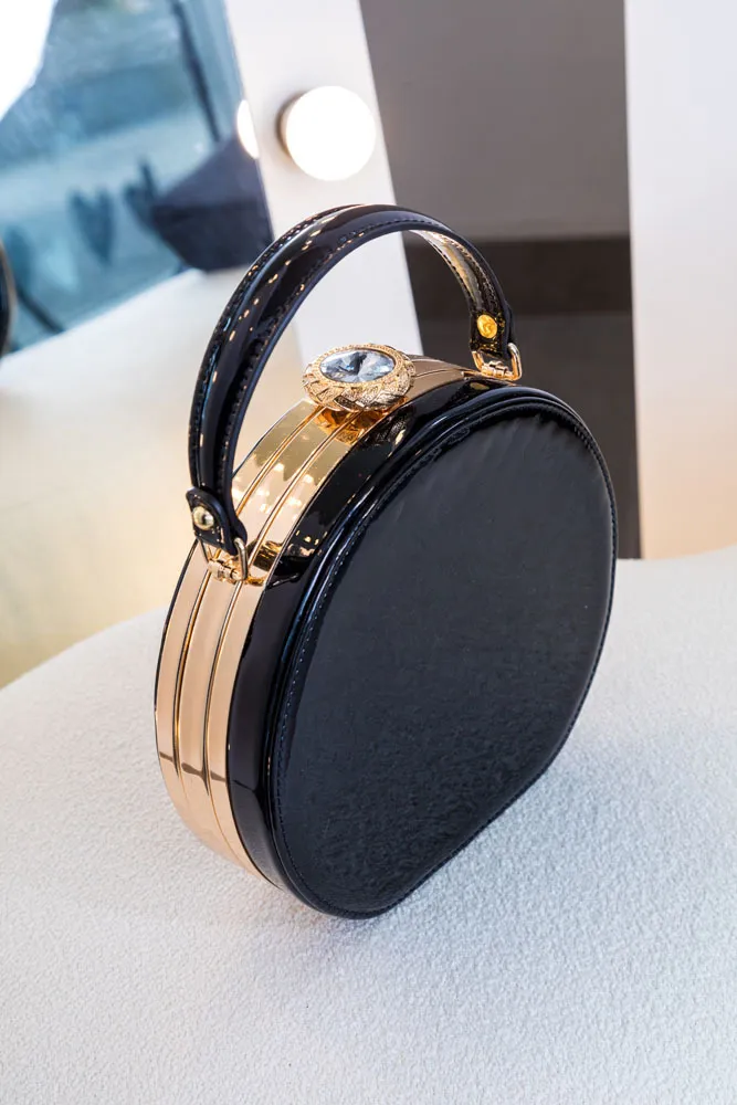 CARTERA REDONDA NEGRA CHAROL