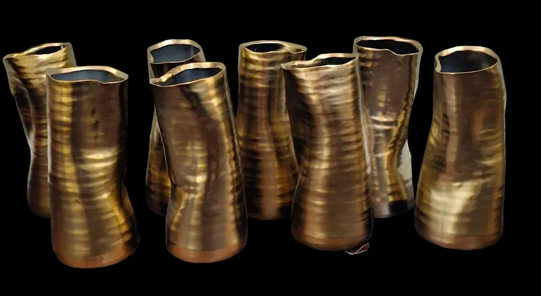 Set of 8 Gold Leaning Vases 