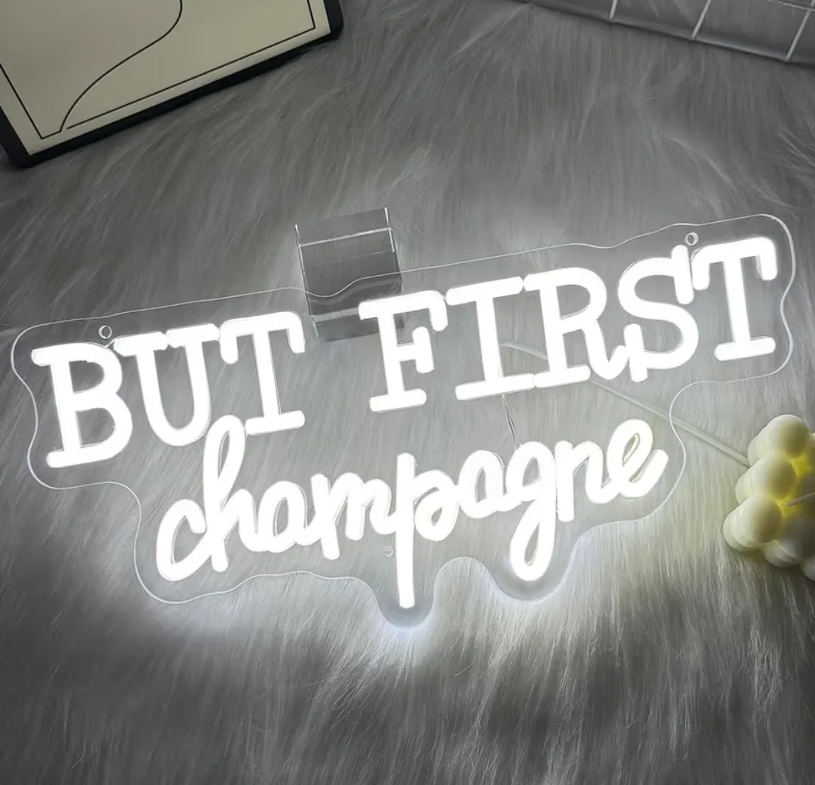 “But first champagne” neon sign