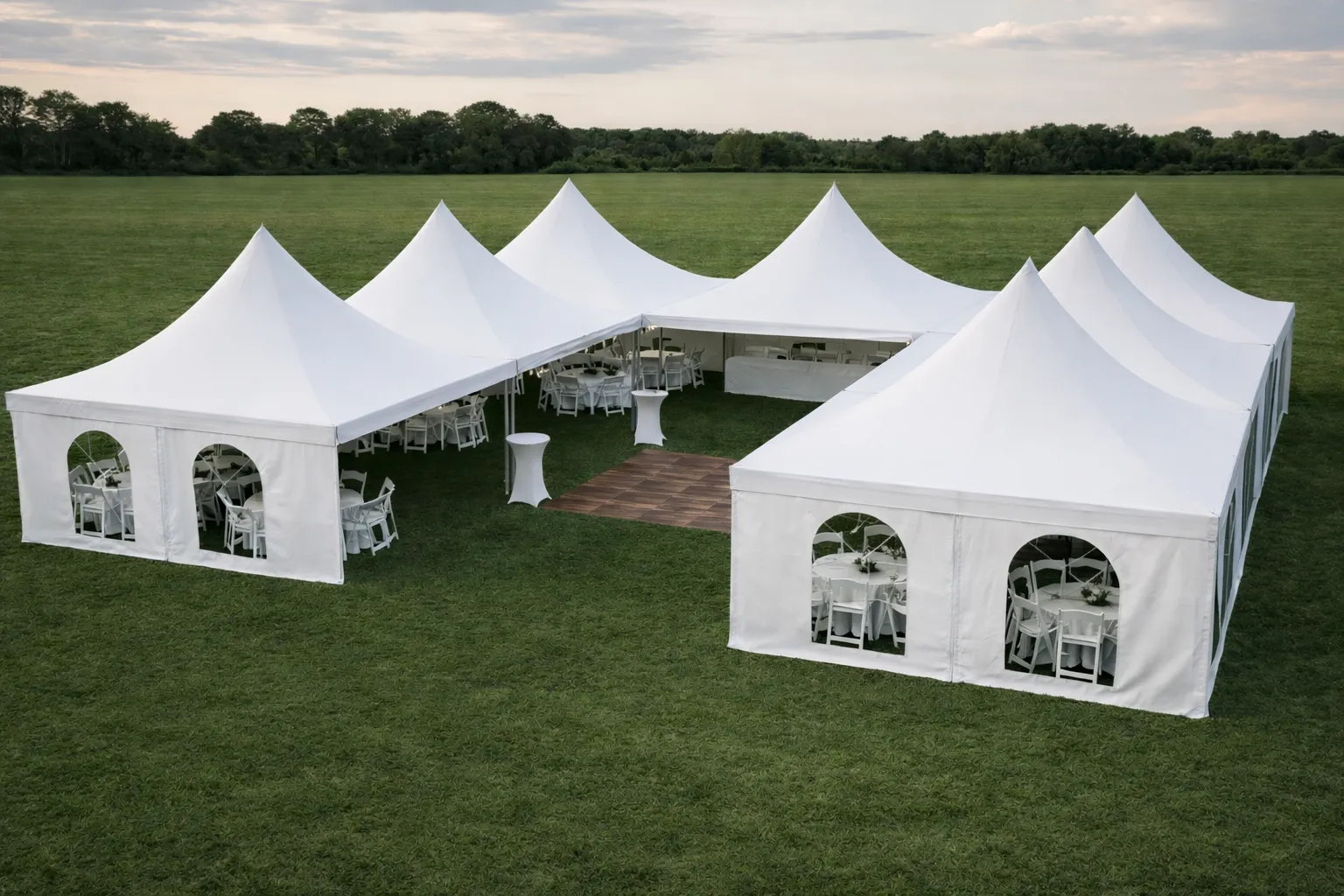 Wedding High-Peak Marquee Tent Package – 2,800 Sq Ft (Includes Tent, Tables & Seating for 200 Guests) Sidewalls, dance floor, lighting, and décor available for an additional fee and can be added during booking.