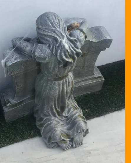 Young Girl Kneeling On Tombstone Decoration