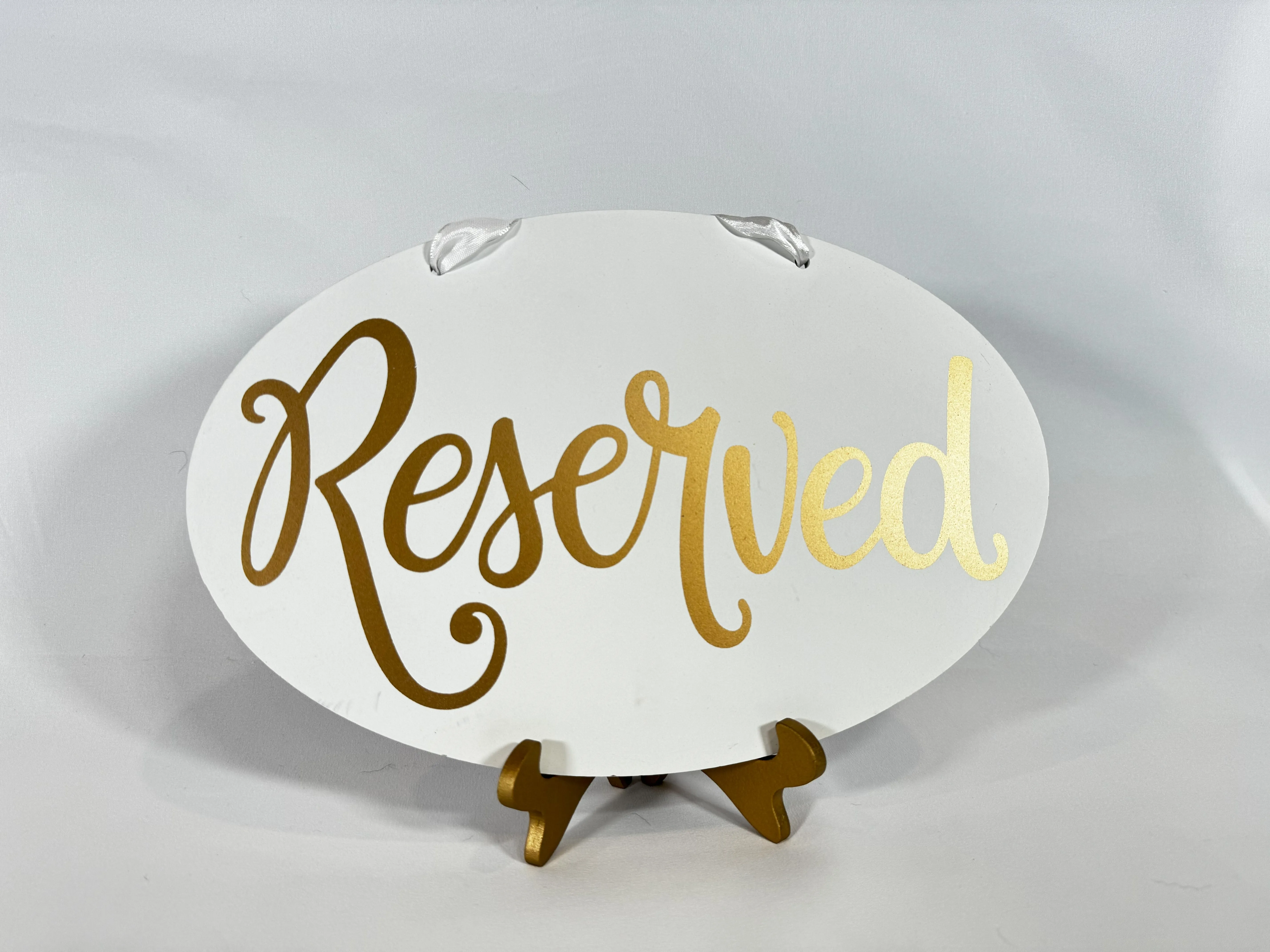 White and Gold Hanging Reserved Sign