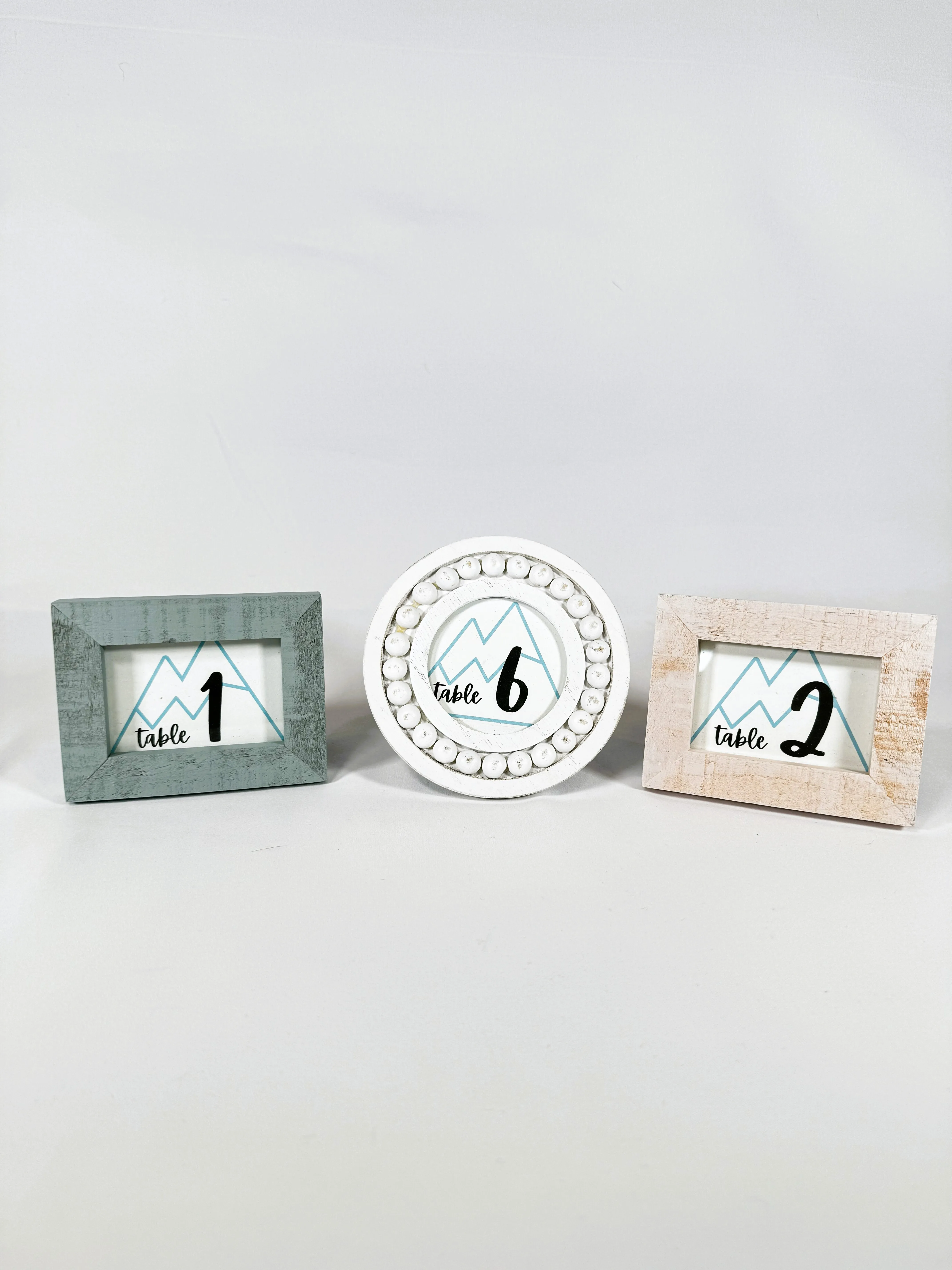 Assorted Blue and peach with White Mountains Framed Table Numbers 1-11