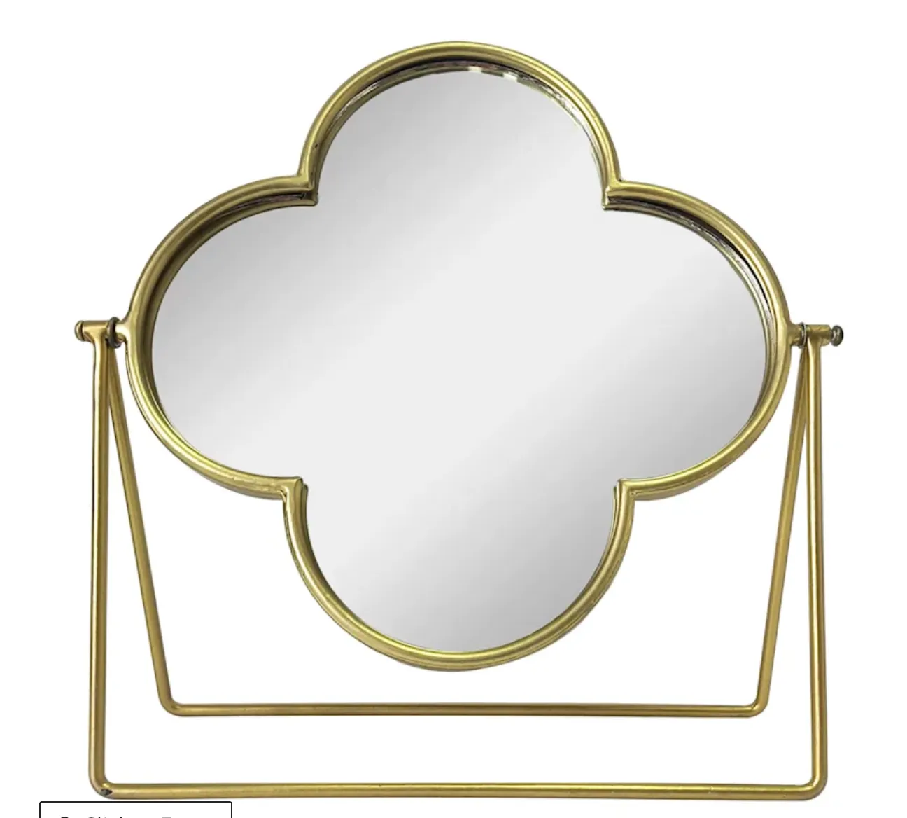 gold table mirror on stand
