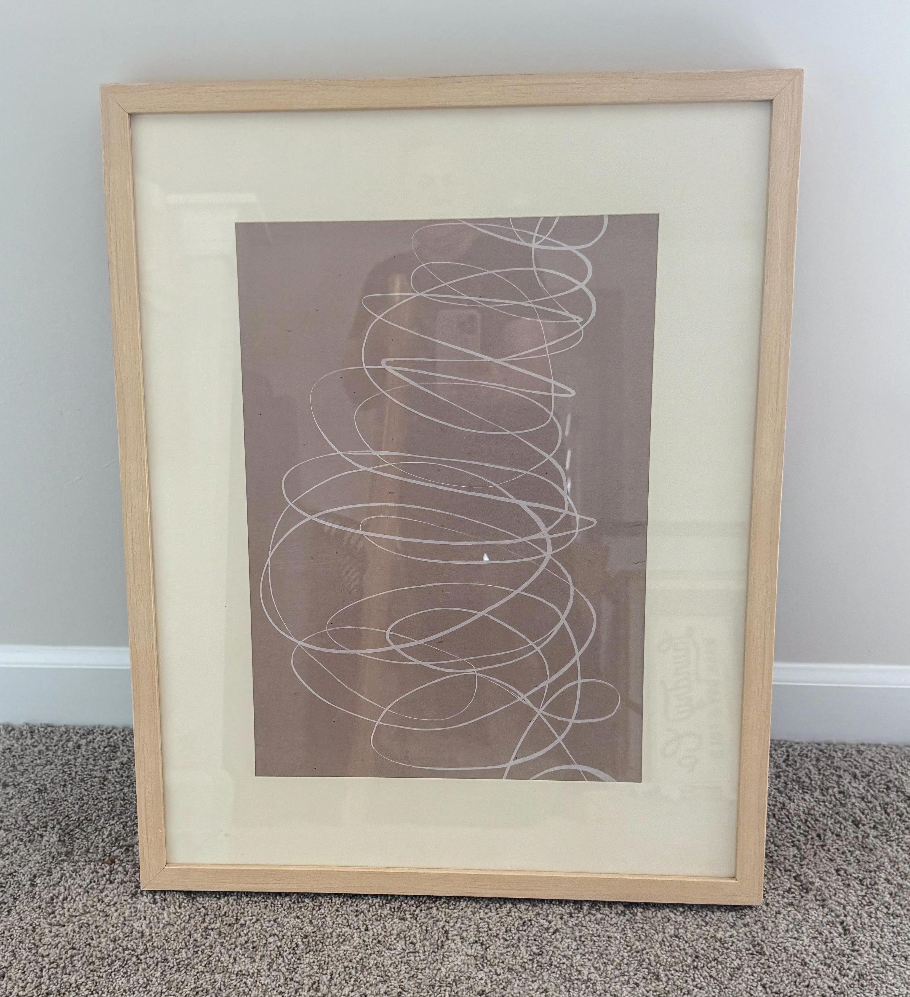 Framed tan wall art