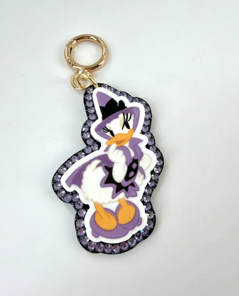 Purple Daisy Duck Witch Halloween Crystal Bag Charm  - Aden & Louise
