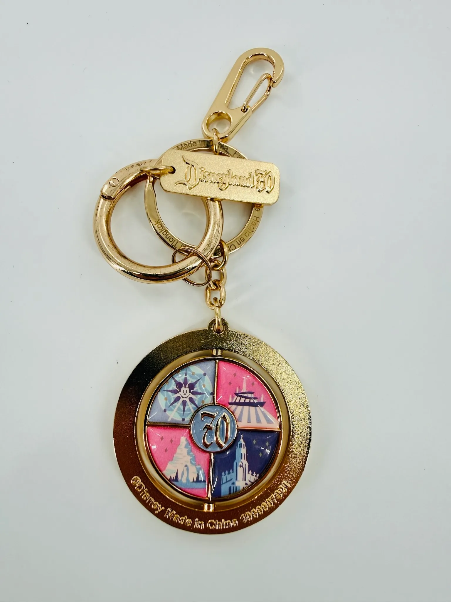 Disneyland 70th Anniversary Rotating Metal Keychain Featuring Parks Icons