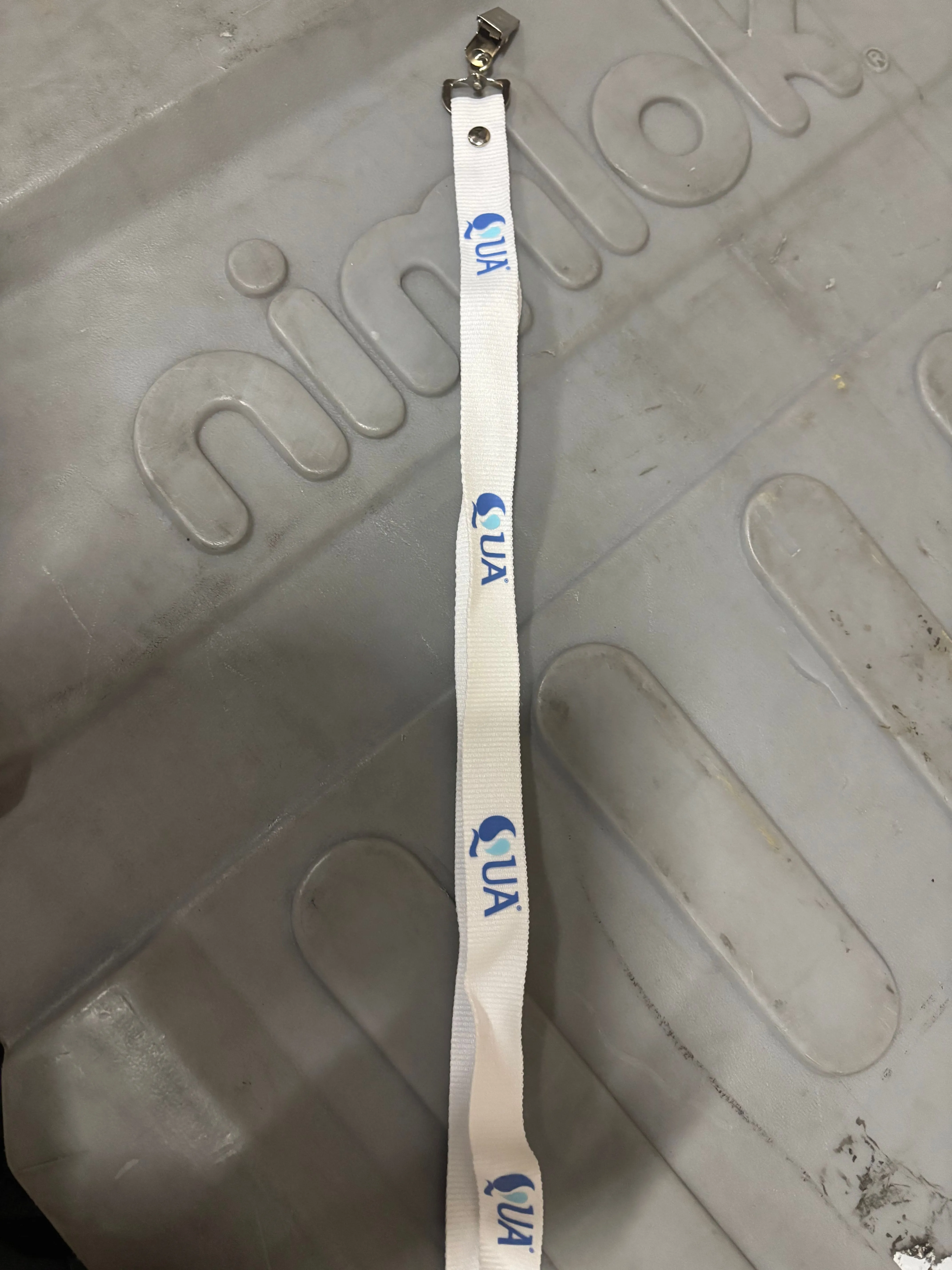 white QUA lanyard
