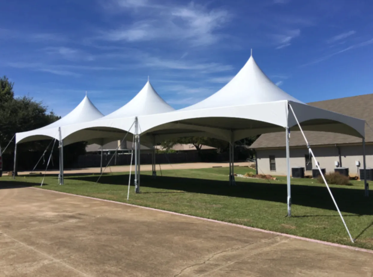 White 20x40 high peak tent rental with elegant swooping peaks for backyard party
