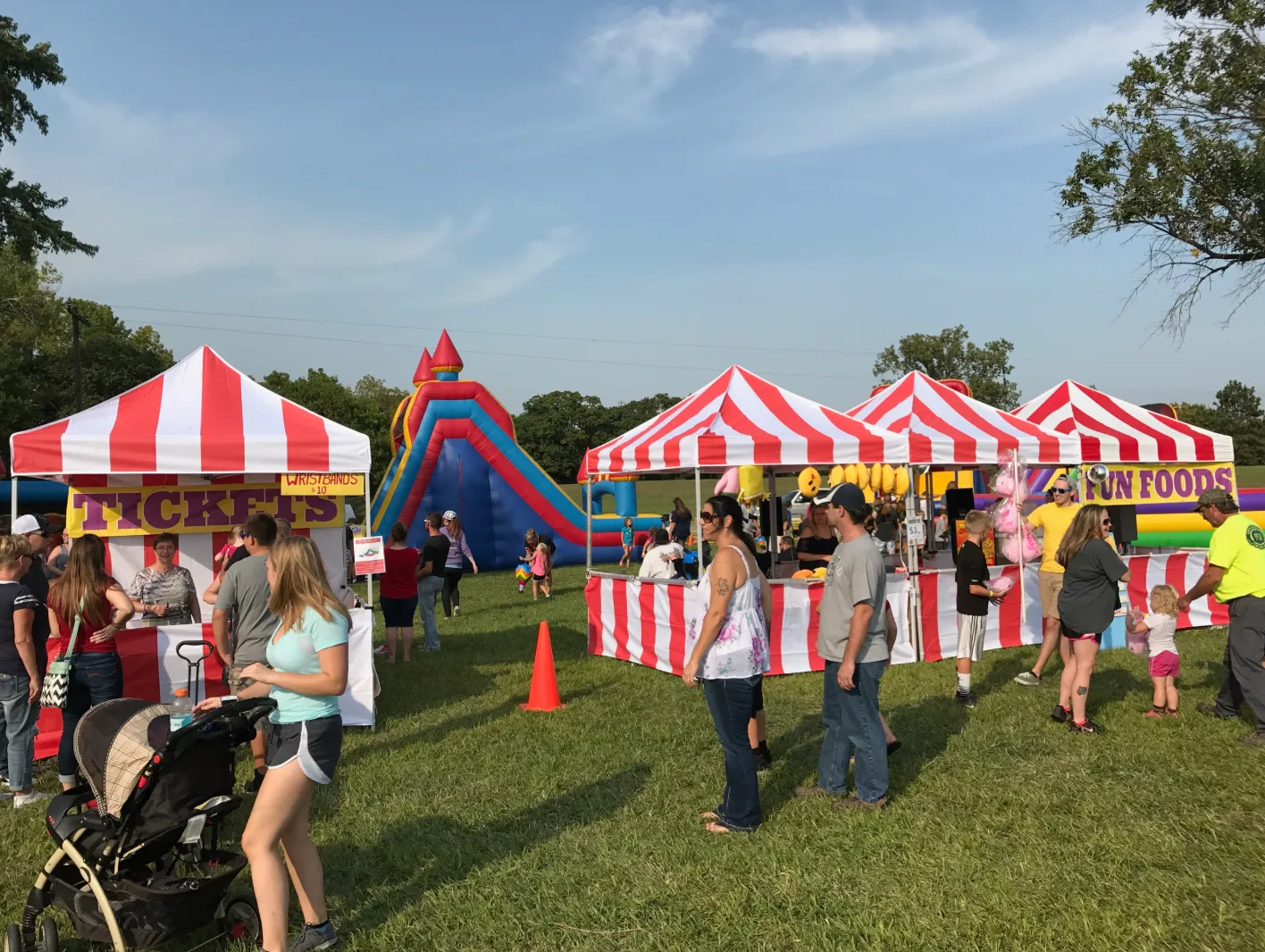 Large interactive inflatable obstacle course setup for a summer event in Topeka, KS.