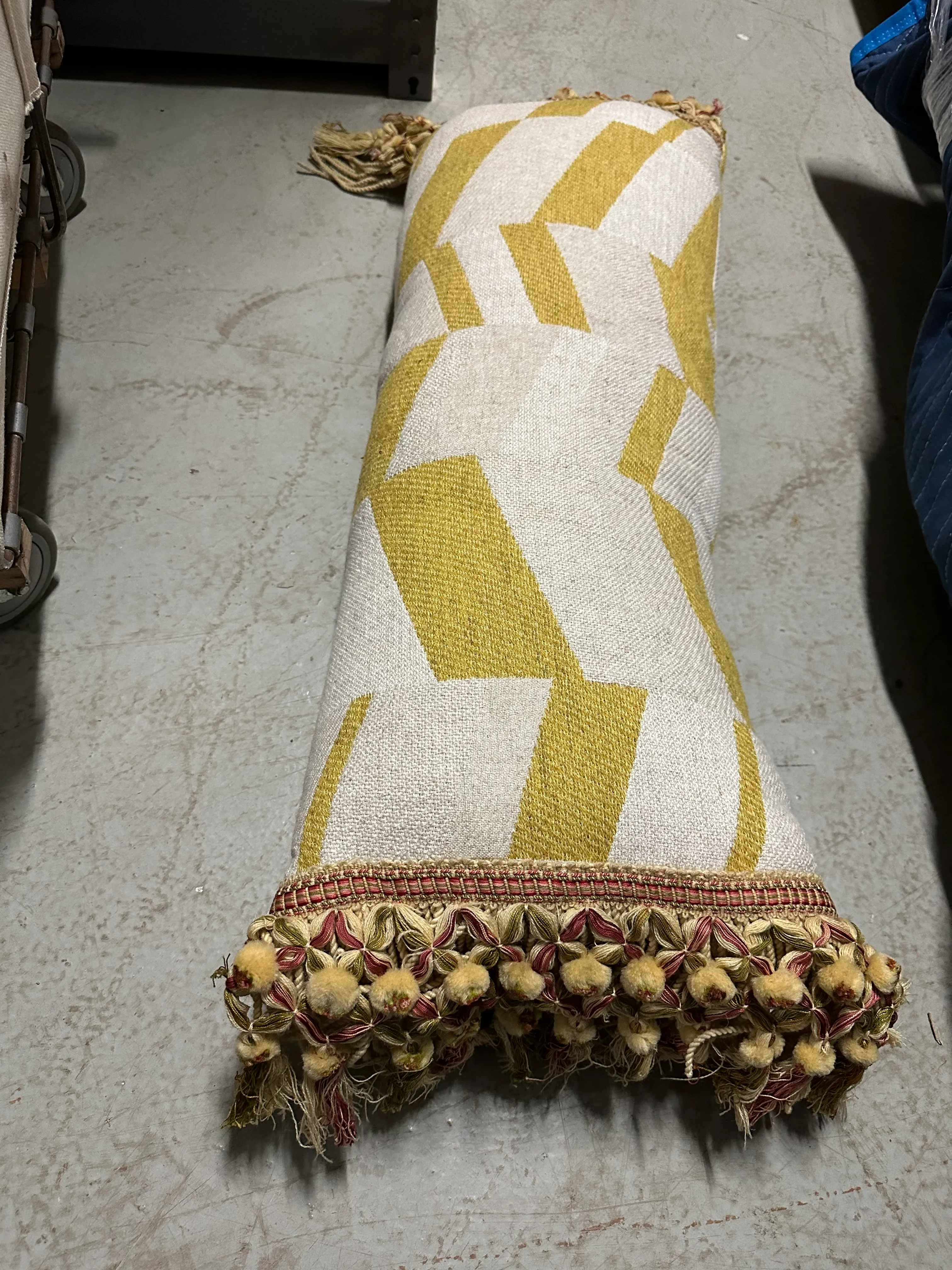 gold and white chevron pattern lumbar pillow with fringe 