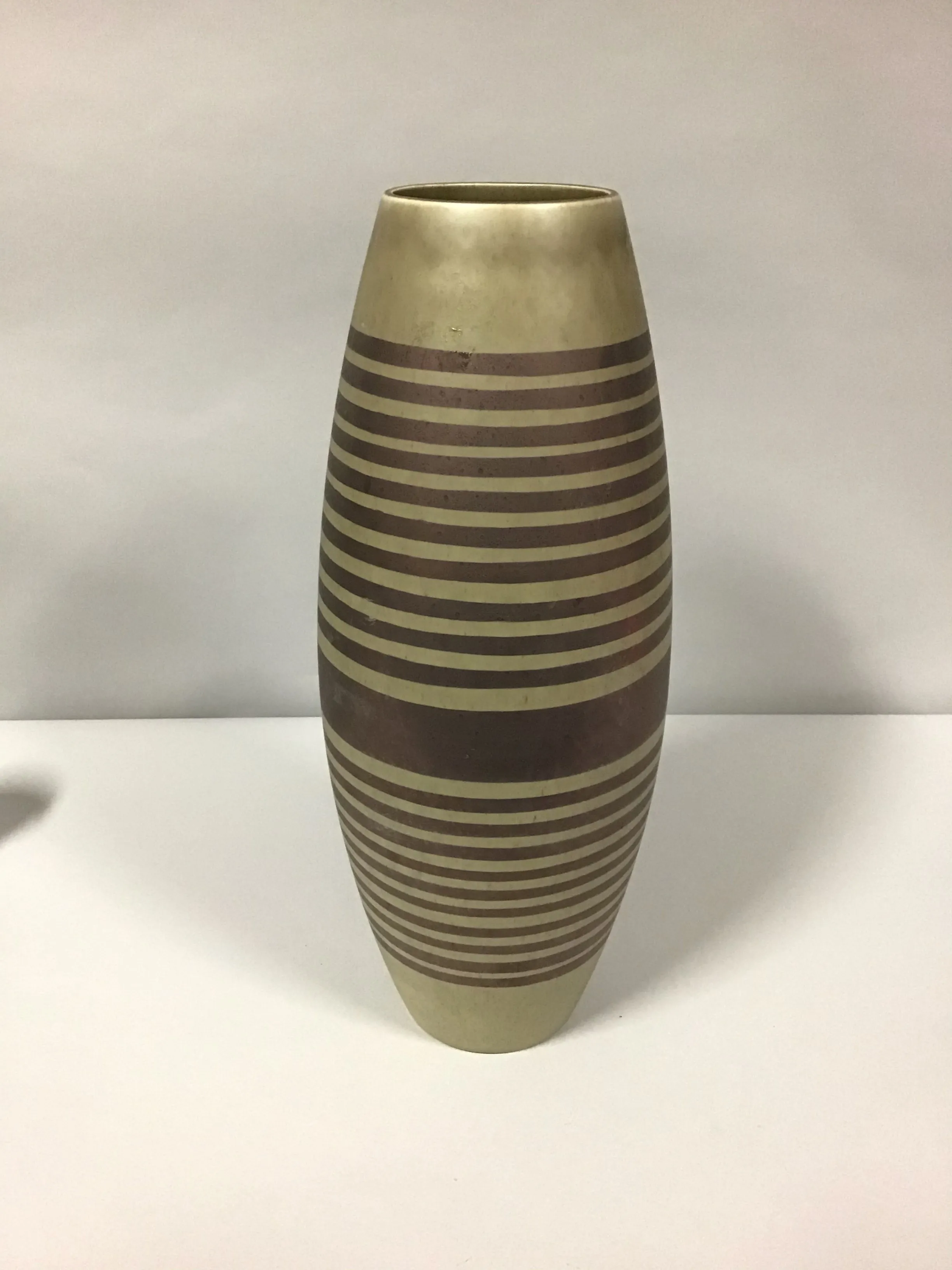 tall brown and bronze vase with horizontal stripes 