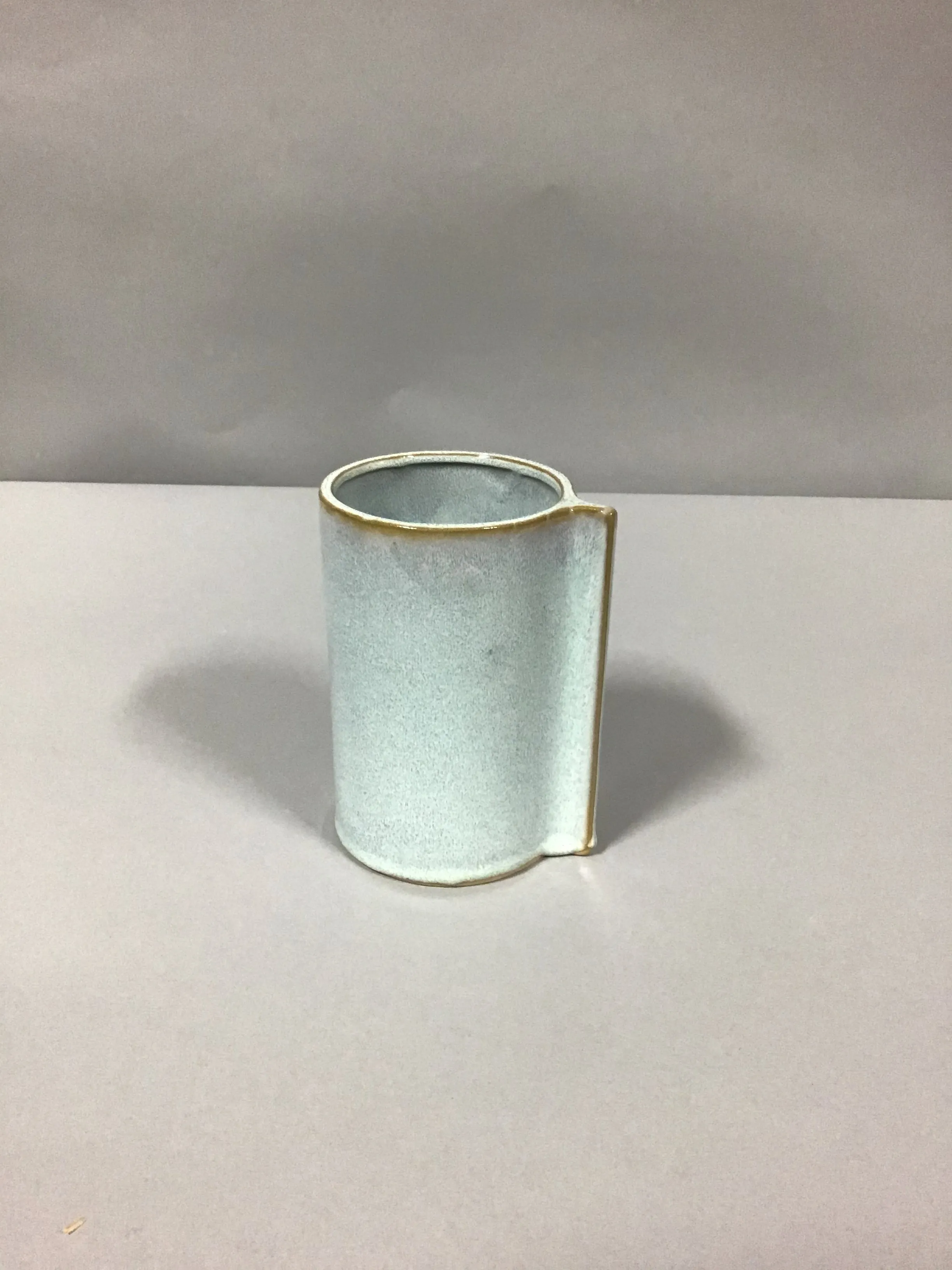 glazed cylinder vase with pinched handle 6"