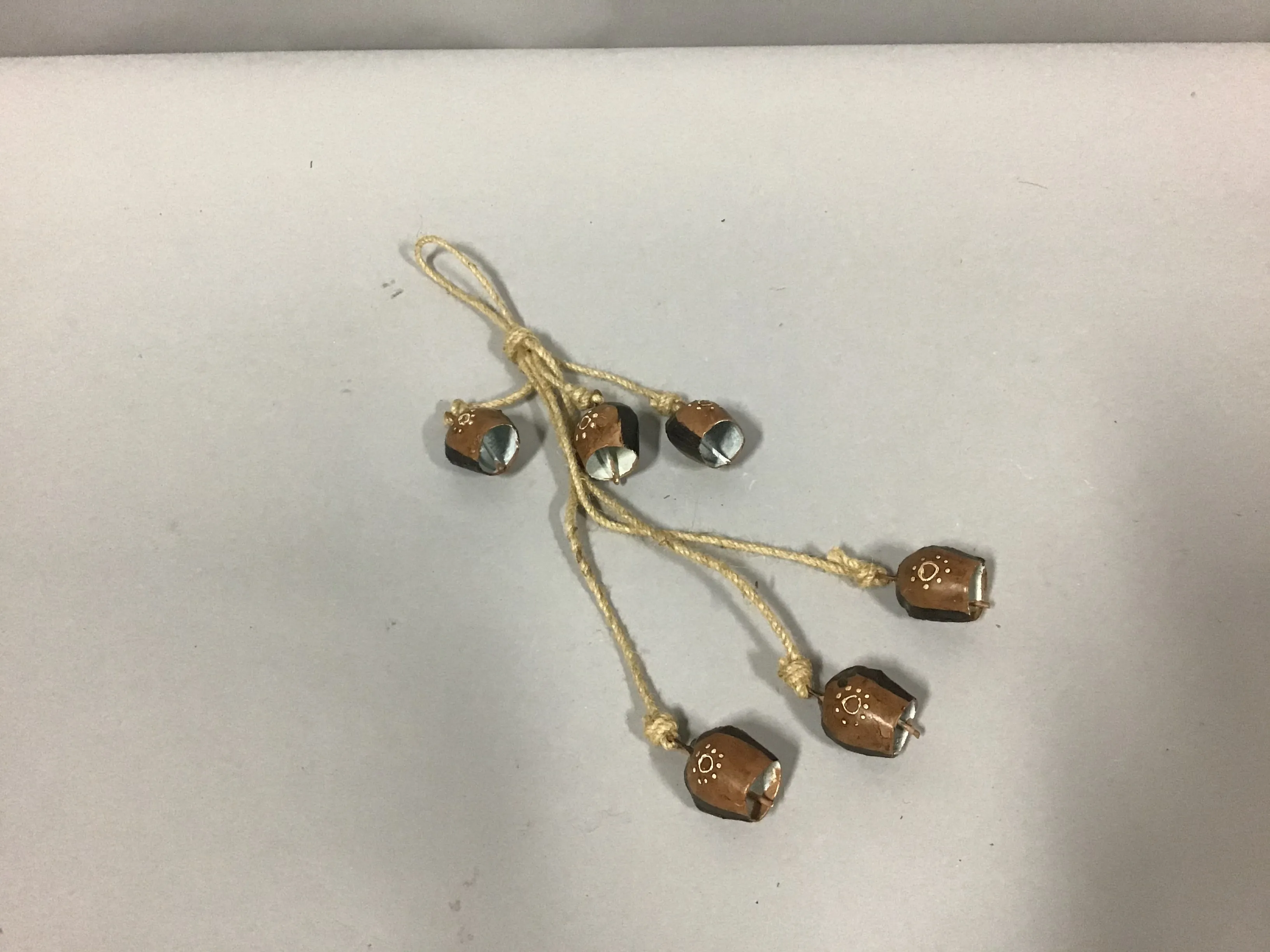 6 painted bells on a rope brass 13"