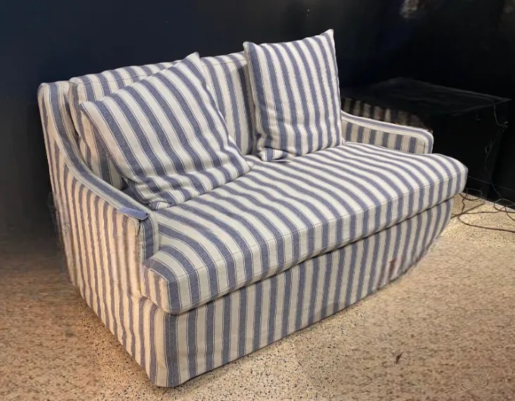 blue and white stripe ticking covered loveseat /sofa