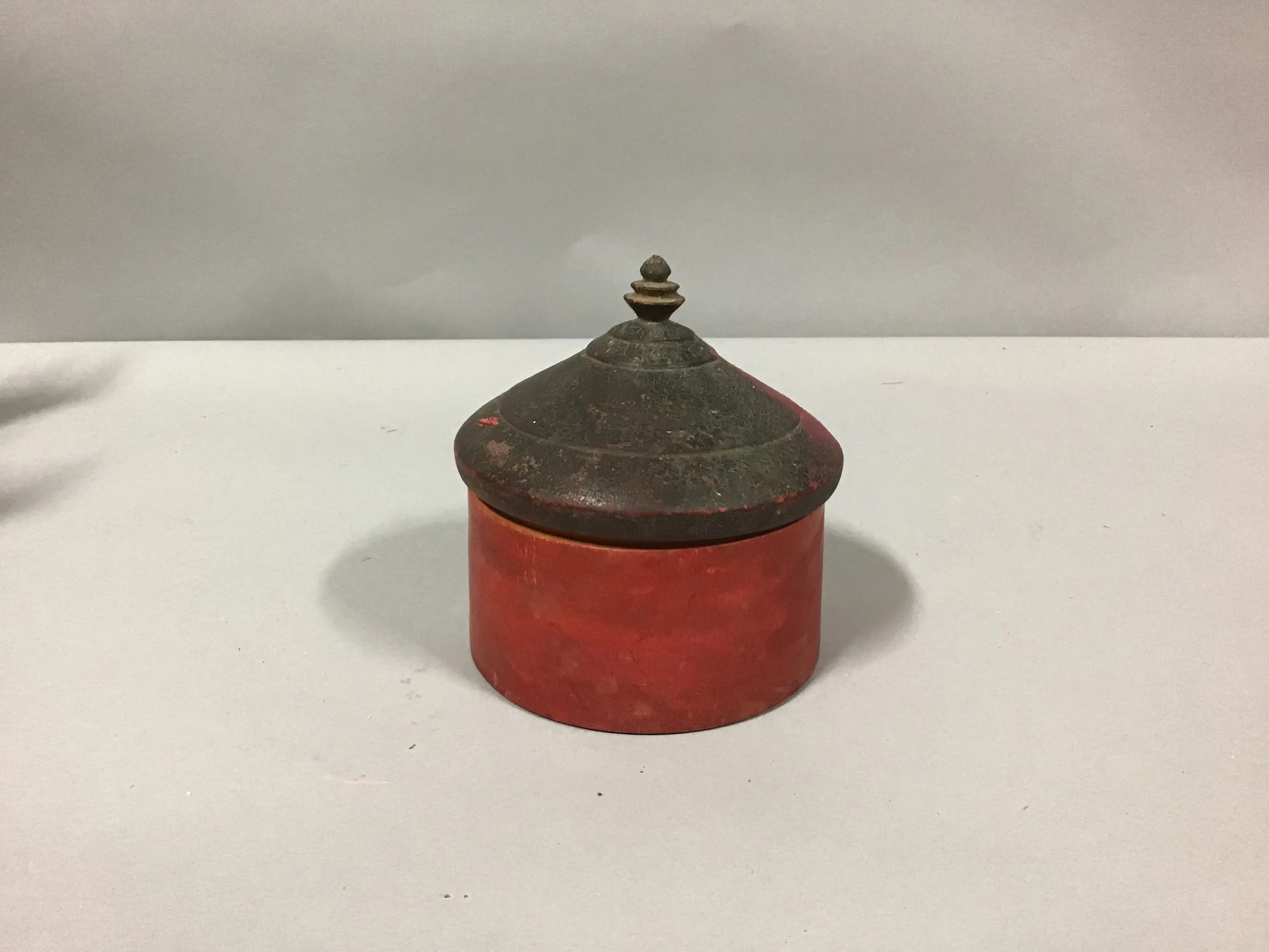tribal pot wood red base pointed top 