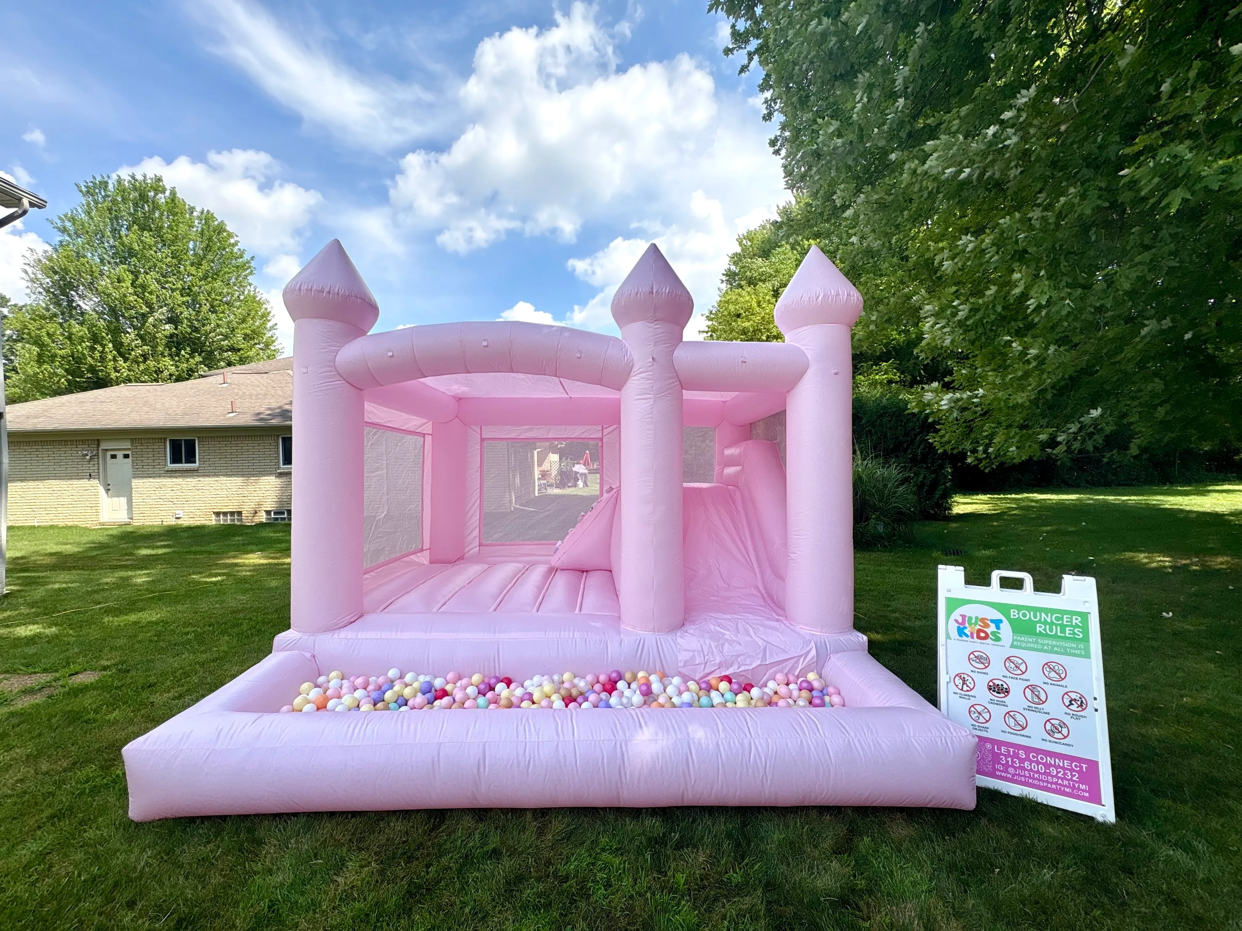 Pastel Pink Inflatable Bounce House with Slide and Ball Pit