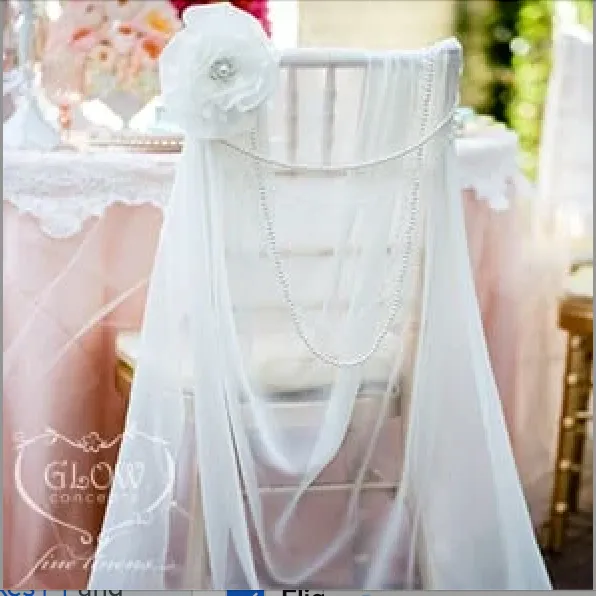 IVORY CHIFFON CHIAVARI CHAIR COVER WITH PEARL FLOWER BROOCH AND PEARL STRINGS