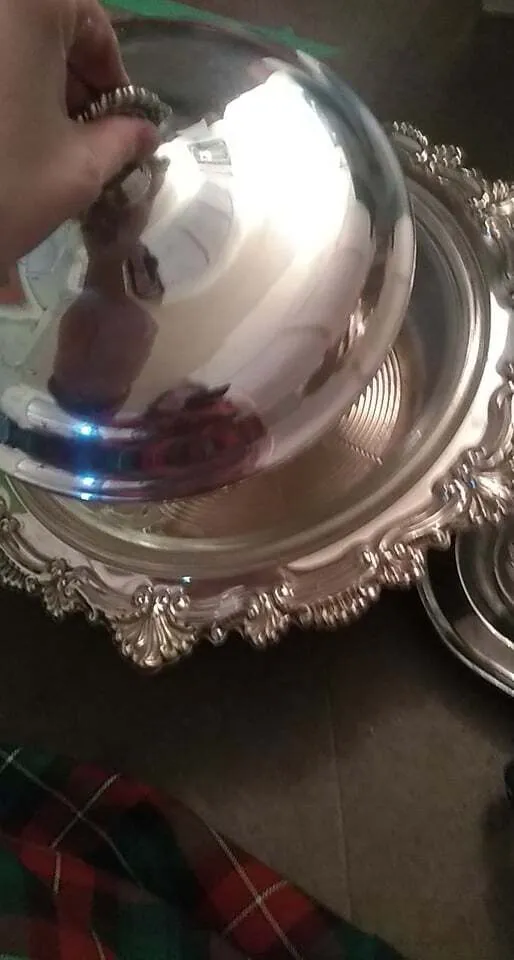 Polished silver serving bowl with glass insert and lid