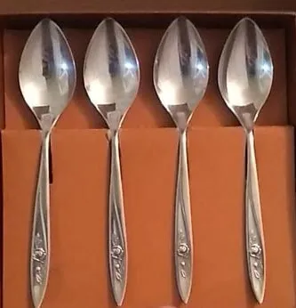 Silver teaspoons with rose embellishment